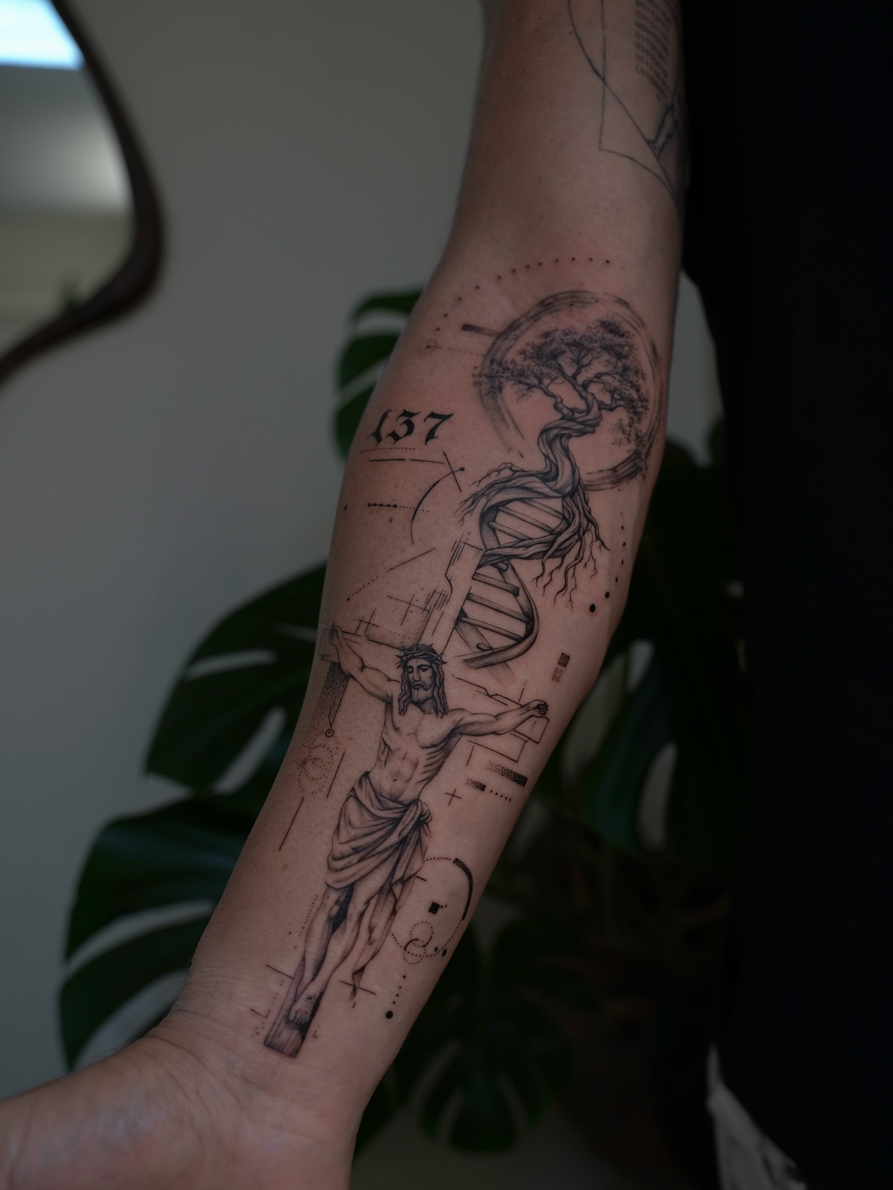 Religious crucifixion scene realism tattoo on the forearm by Christian Guerrero