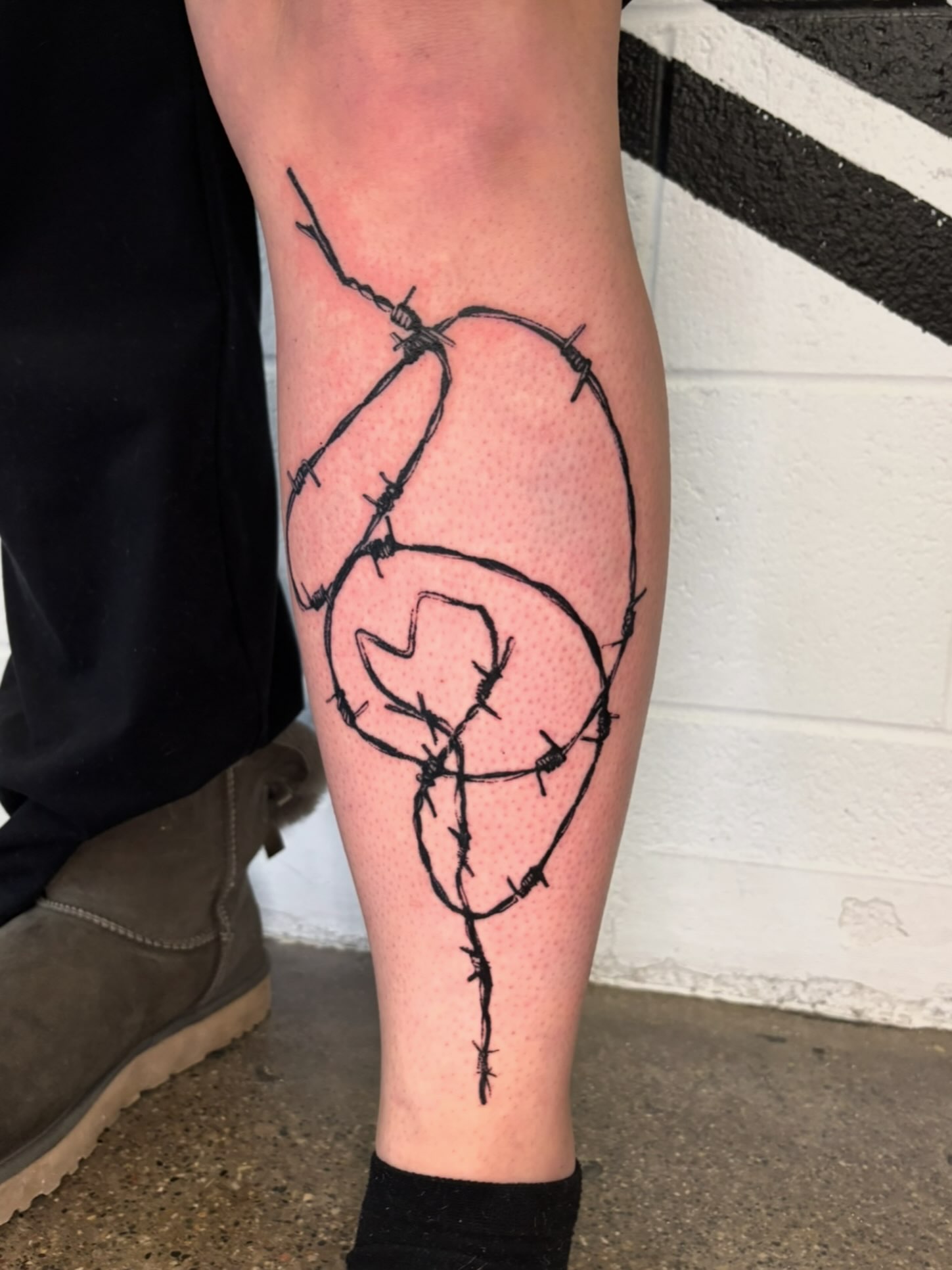 Barbed wire black and grey tattoo on the calf by @lil_stinker_5000, Portland, Oregon