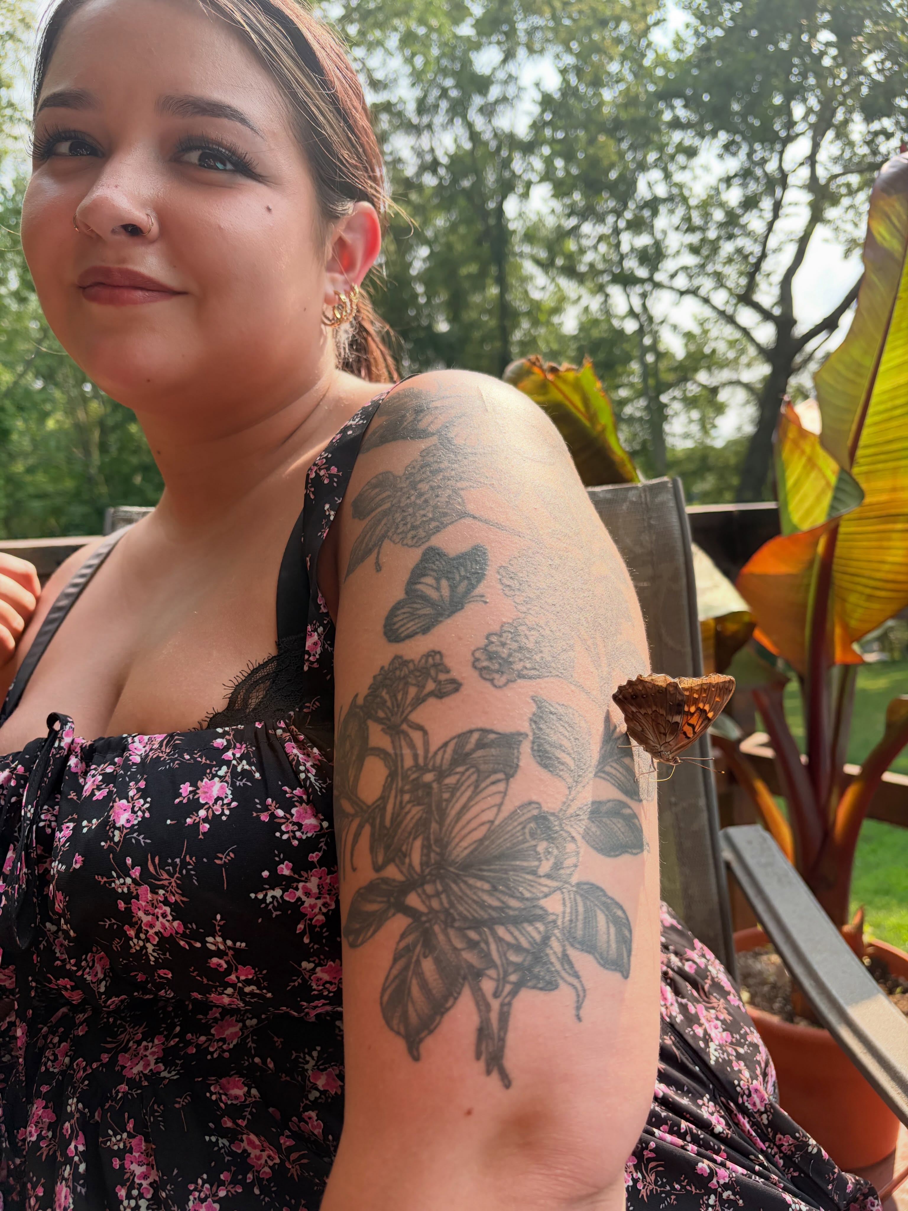 Butterflies and flowers black and grey tattoo on the upper arm by Saffron Florea, Tiffin, Ohio