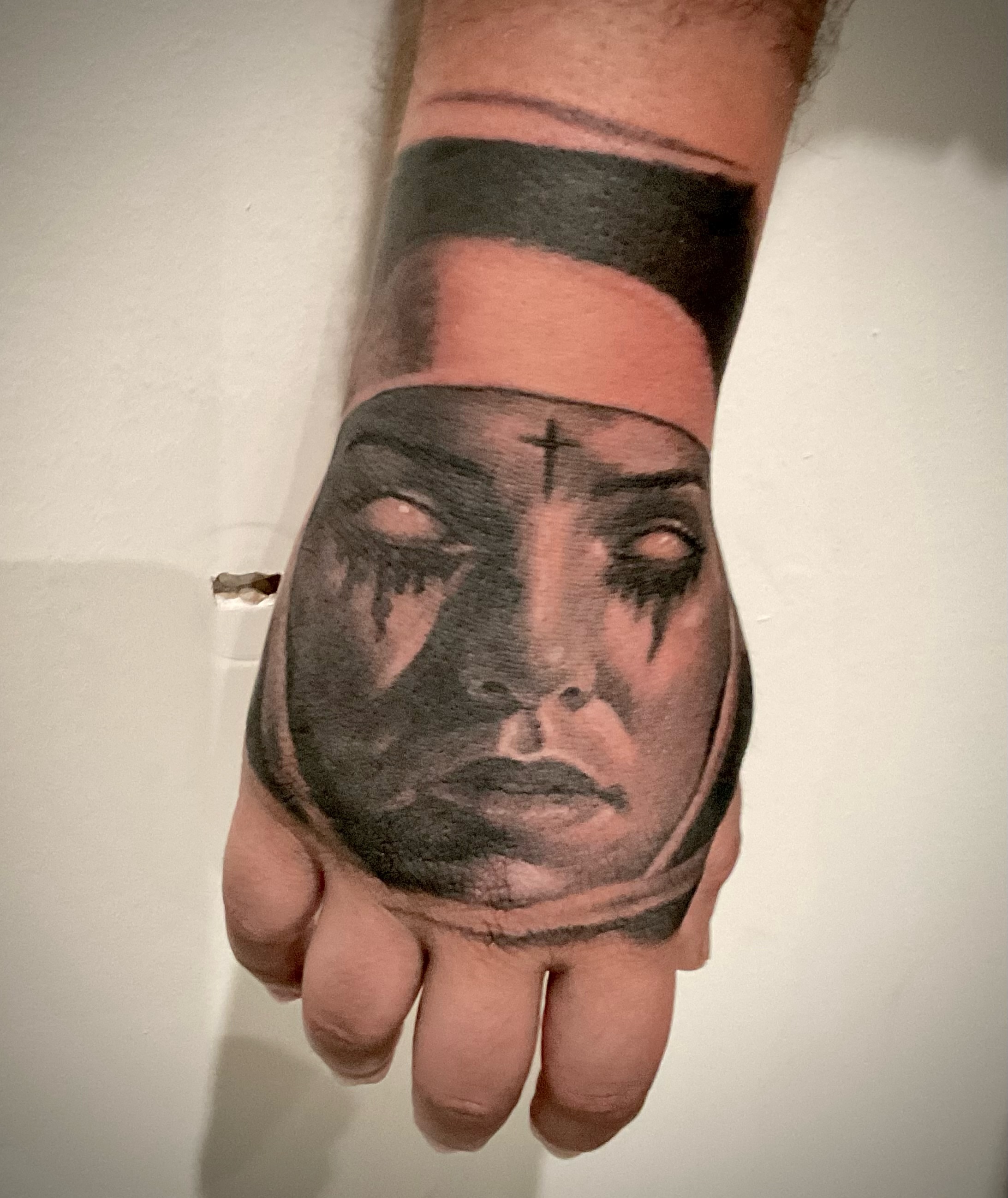 Female face realism tattoo on the hand by Josh Williams, Chattanooga, Tennessee