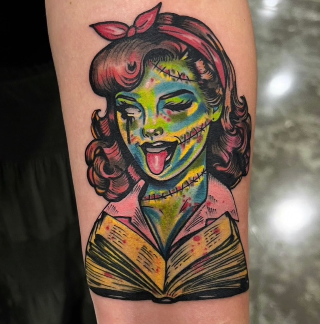 Zombie girl reading book American traditional tattoo on the forearm by Hugh Anthony Washington, Hattiesburg, Mississippi