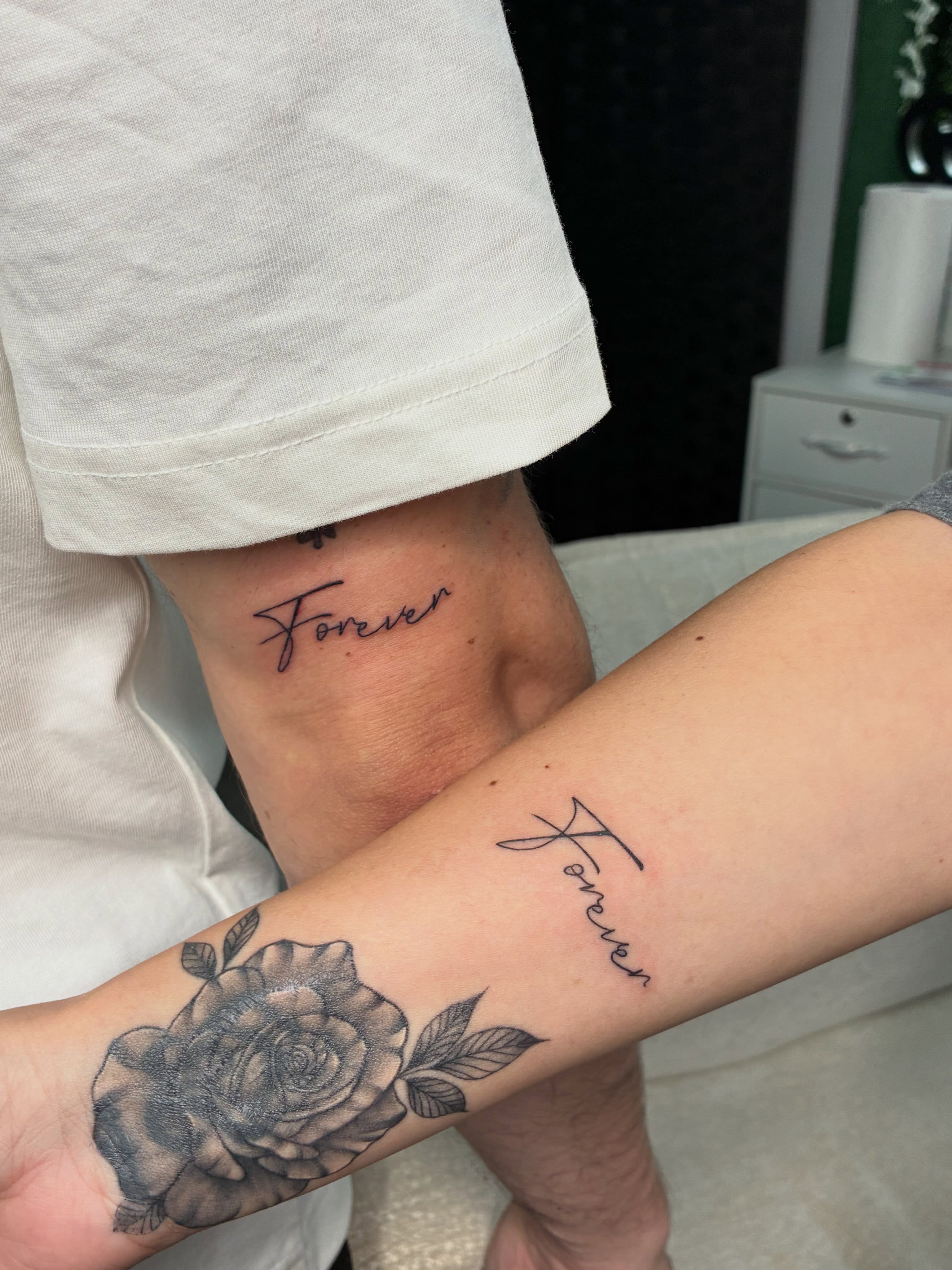 Forever black and grey tattoo on the forearm by Tattoos by Hailey