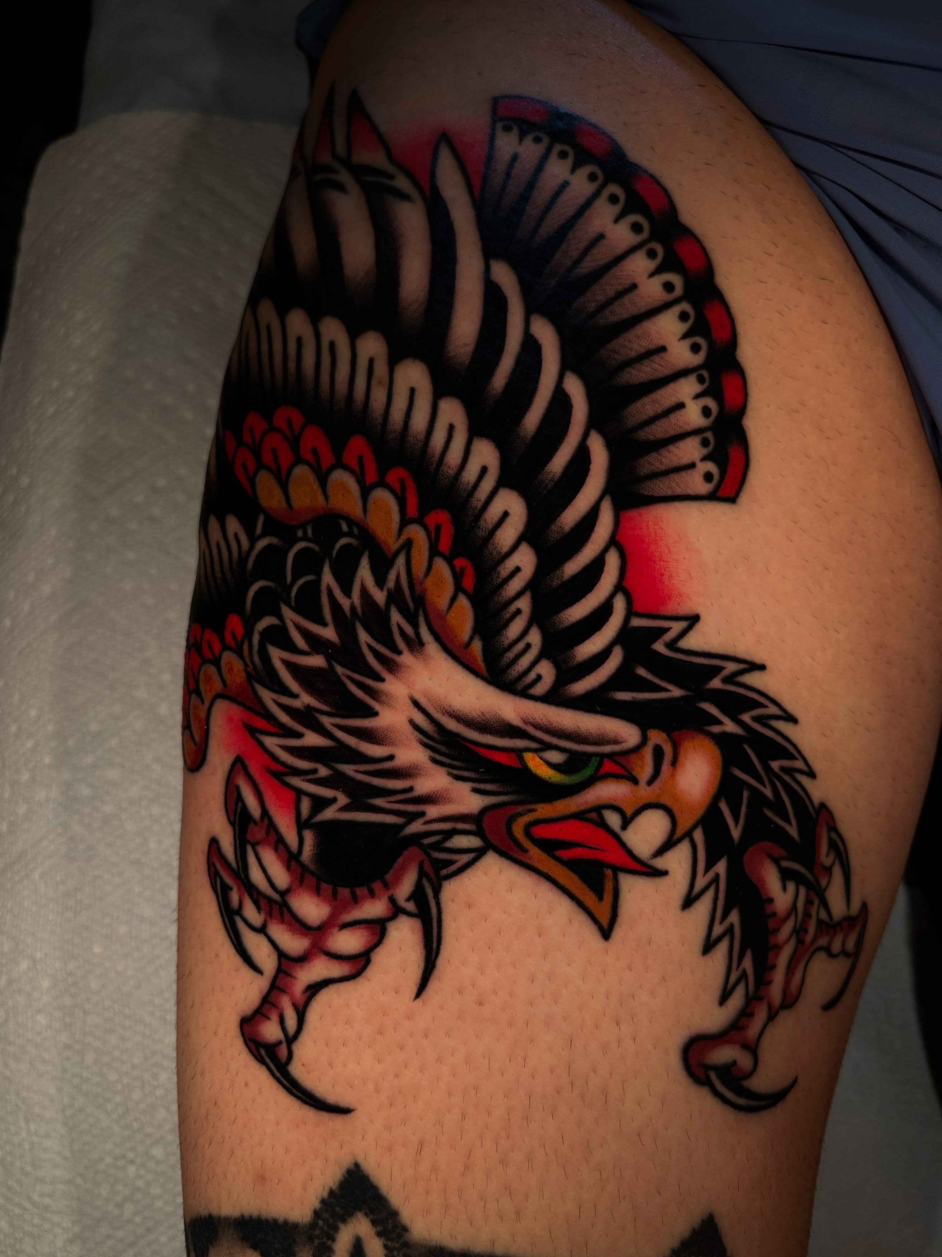 Eagle American traditional tattoo on the shoulder by Lexi Kniskern