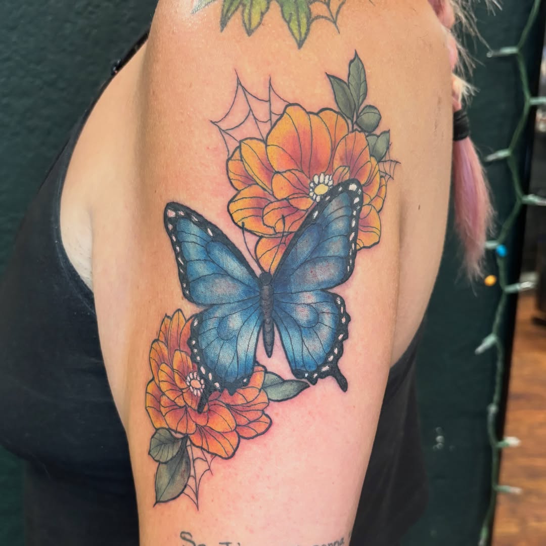 Butterfly and flowers realism tattoo on the forearm by Emma ๐