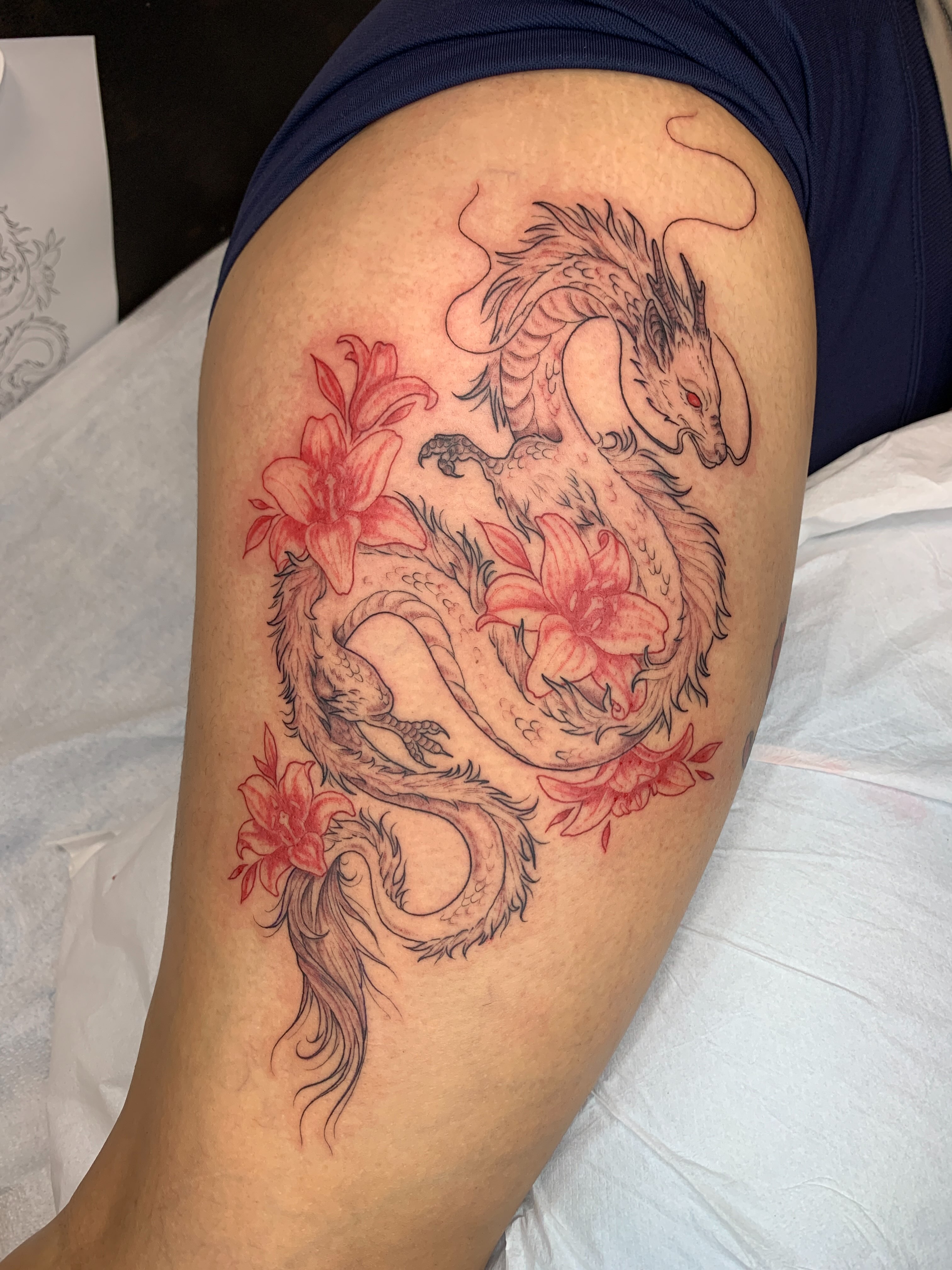Dragon and lilies japanese irezumi tattoo on the thigh by Kitty Jones, Berkeley, California