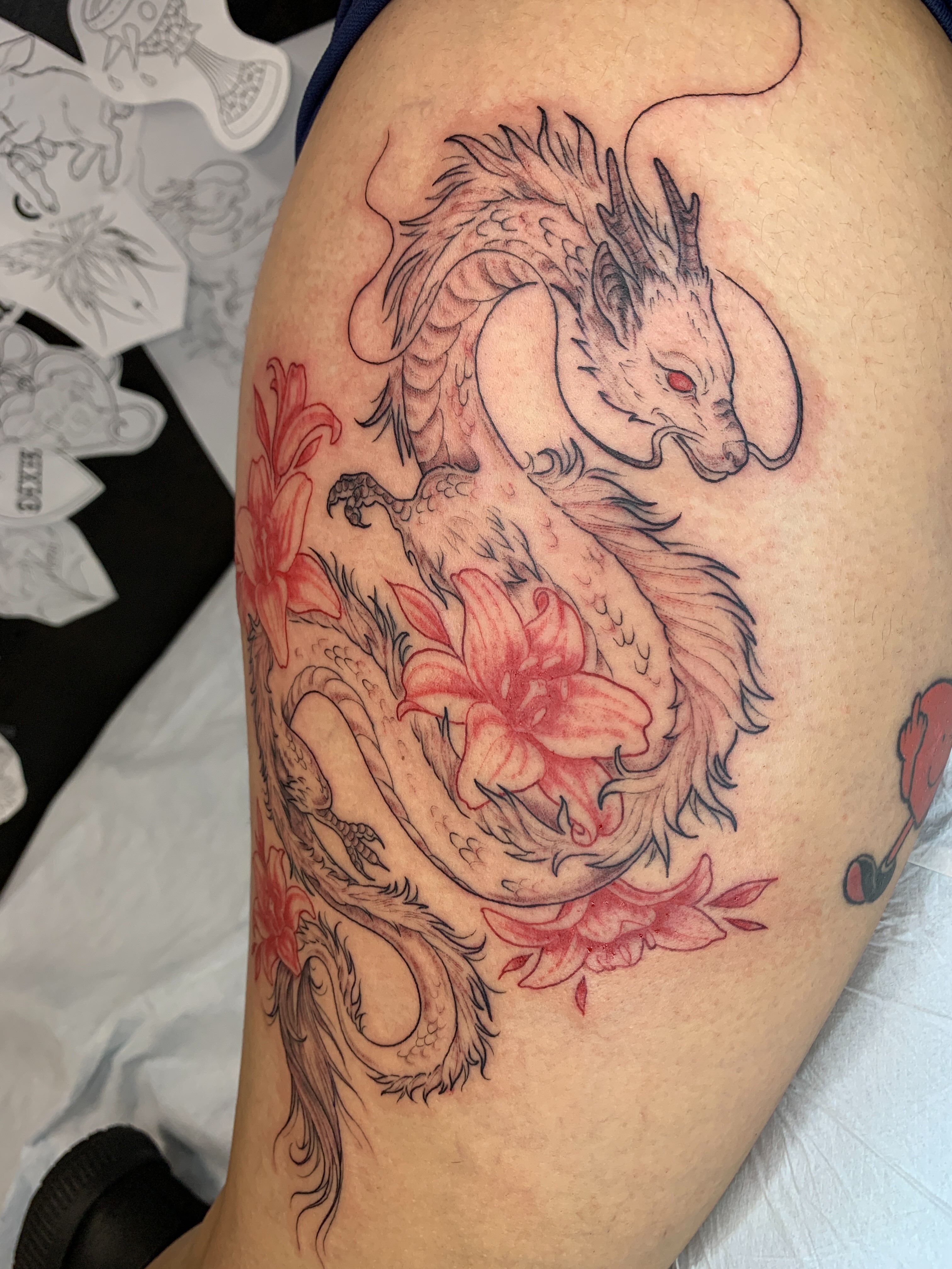 Dragon and lilies japanese irezumi tattoo on the thigh by Kitty Jones, Berkeley, California