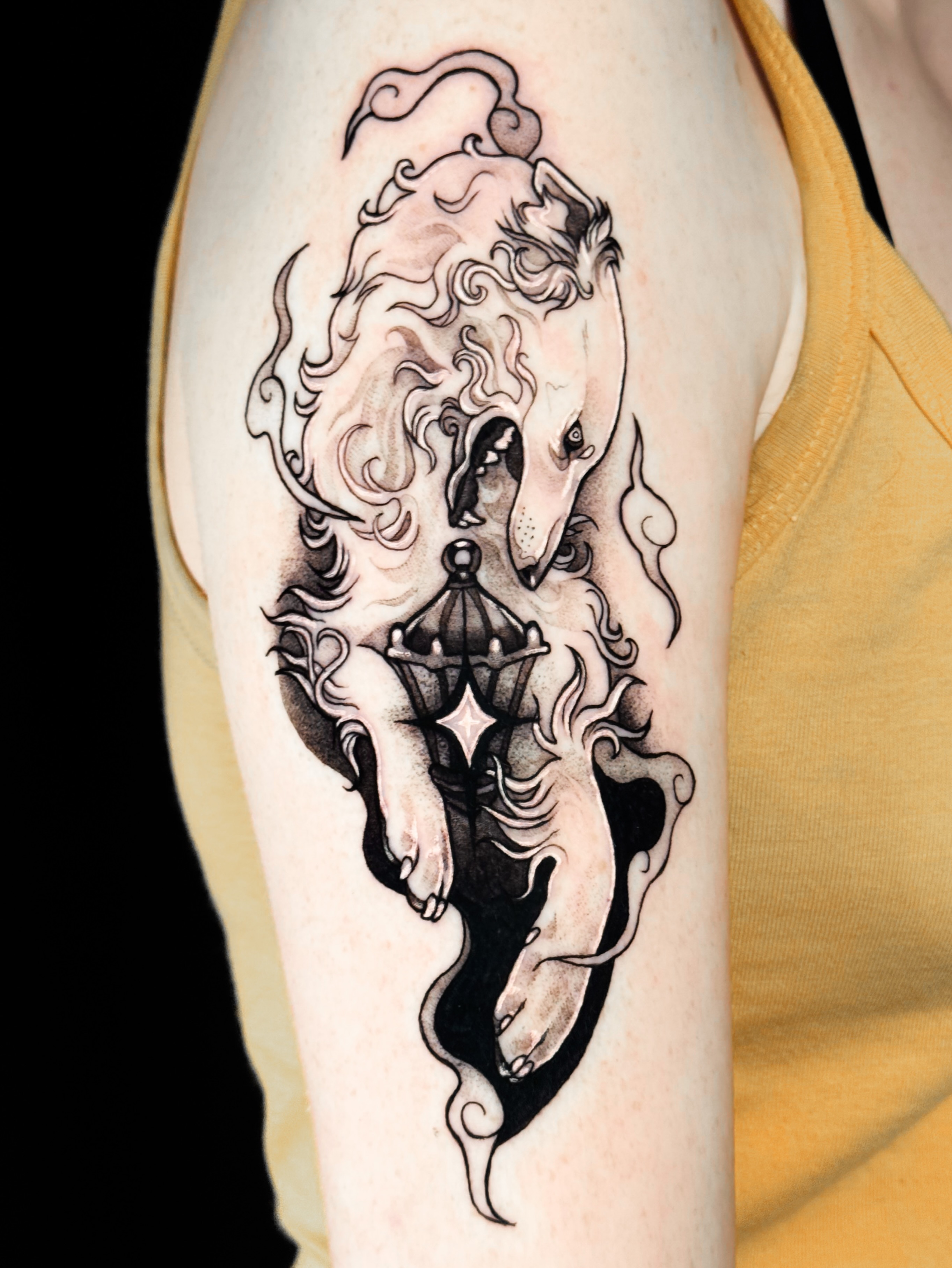 Dog with lantern black and grey tattoo on the forearm by Yasemin πΉπ·π¬π§ San Jose based tattoo artist