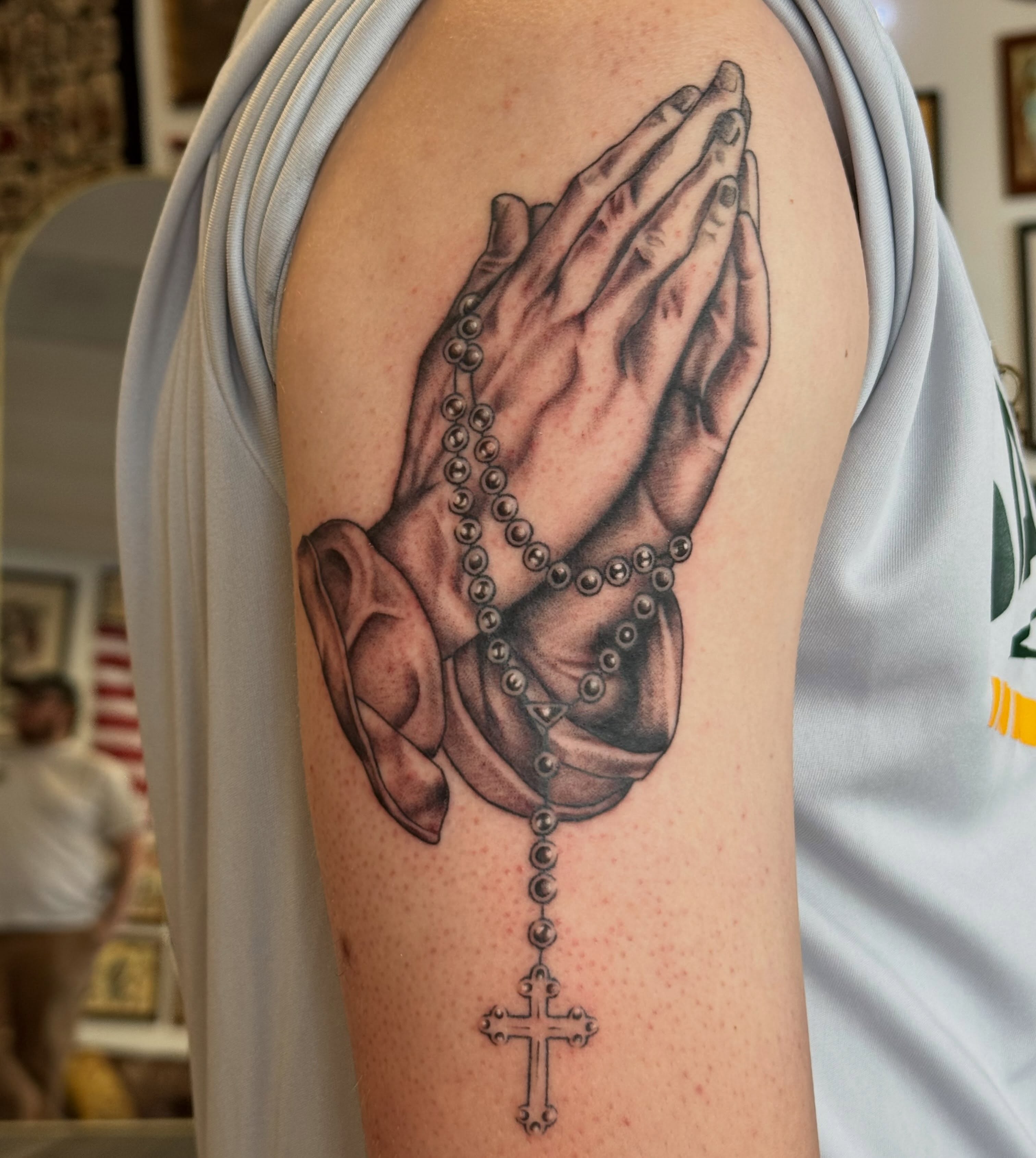 Praying hands with rosary realism tattoo on the forearm by katie lou, Norwich, Connecticut