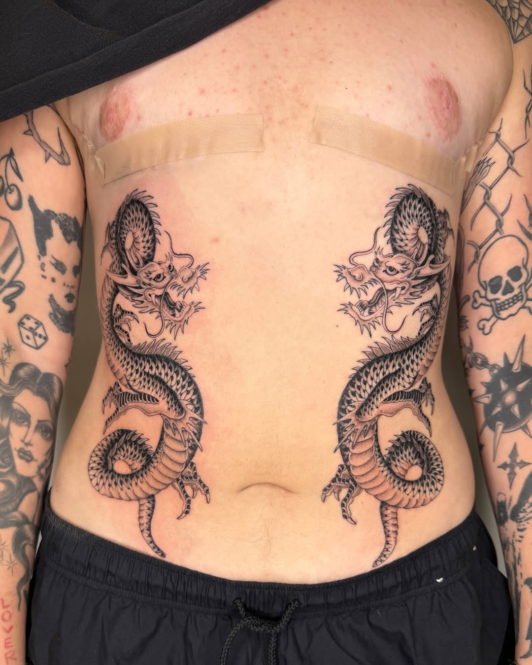 Dragons black and grey tattoo on the ribs by IVY