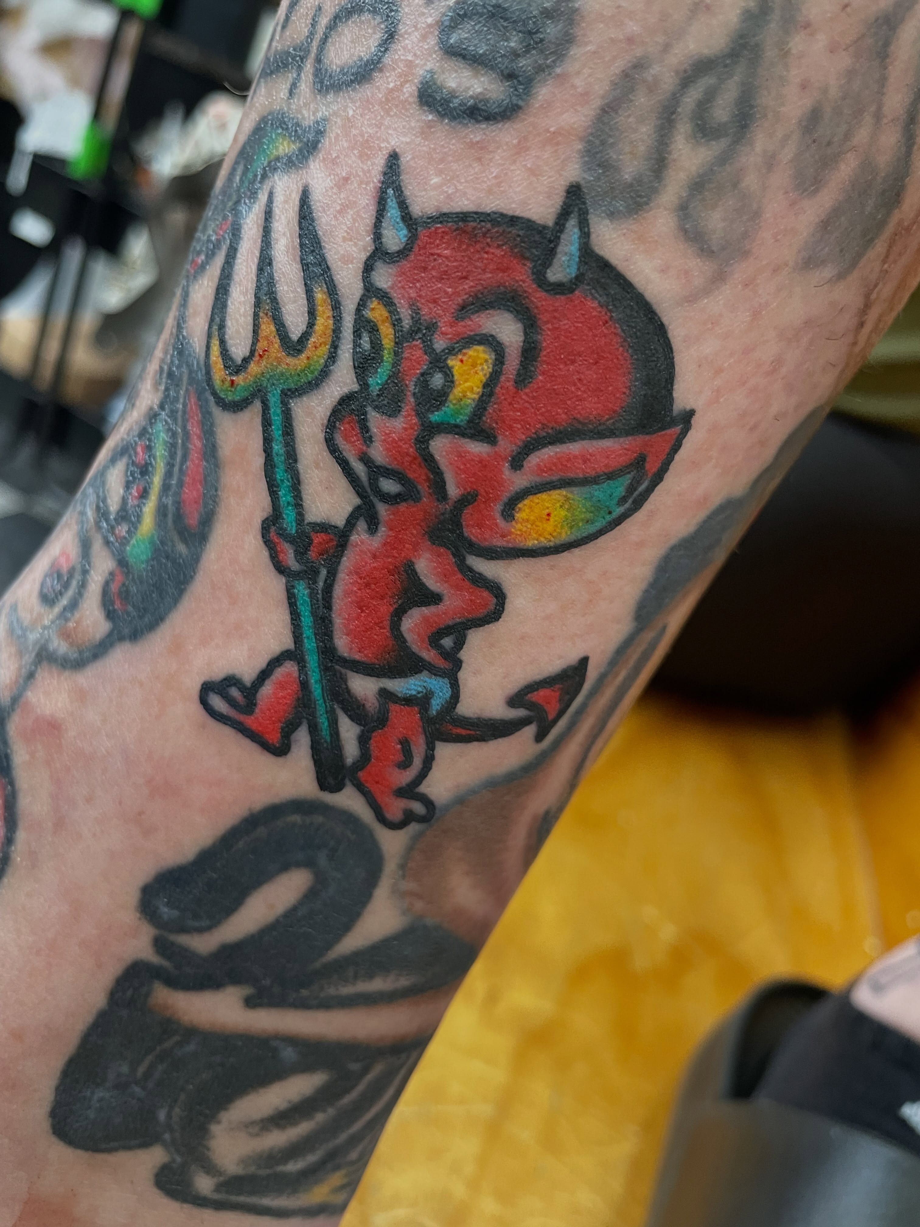 Red devil American traditional tattoo on the forearm by dave rash