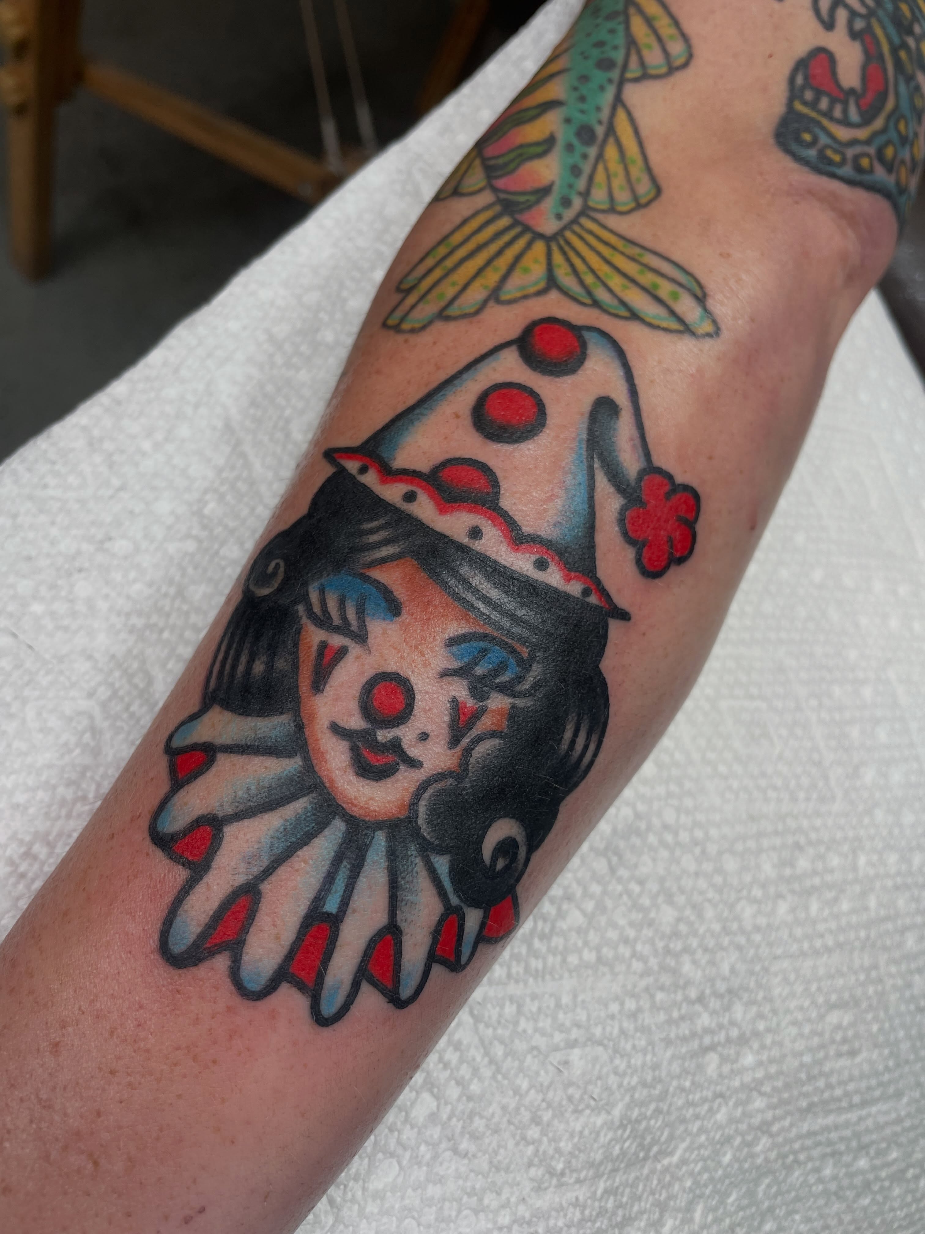 Clown American traditional tattoo on the forearm by dave rash