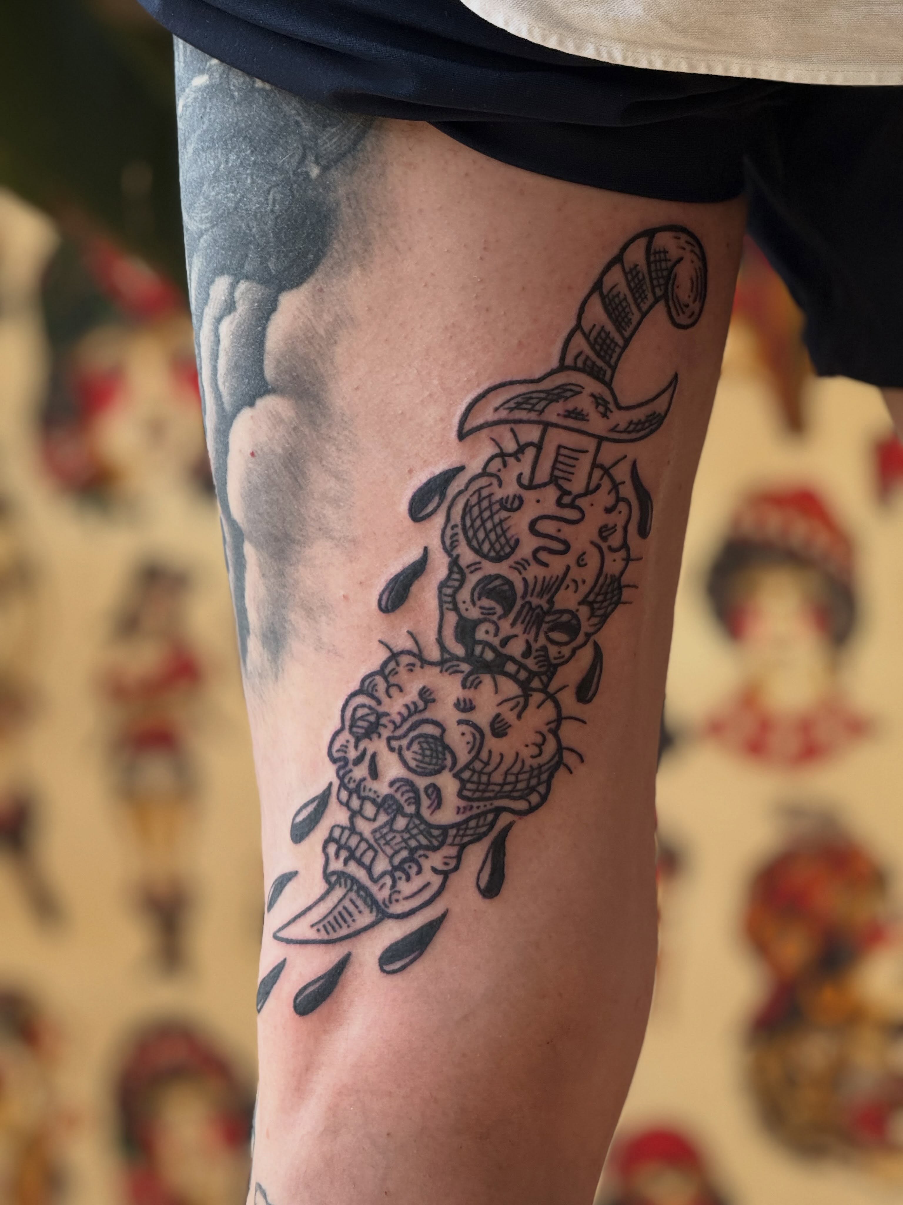 Skulls and knife American traditional tattoo on the forearm by Eric Guntor, Philadelphia, Pennsylvania