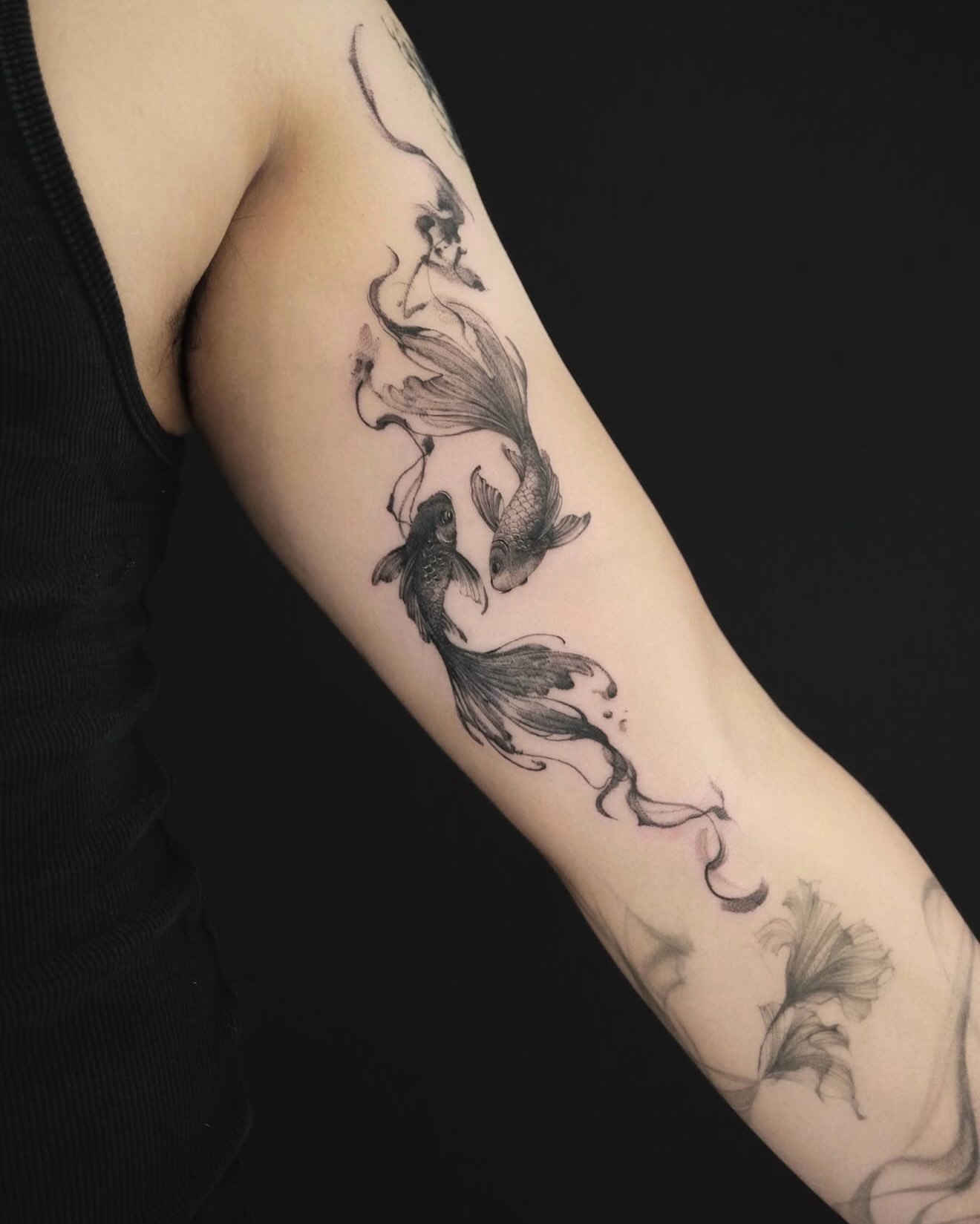 Koi fish black and grey tattoo on the forearm by MJ tattooist