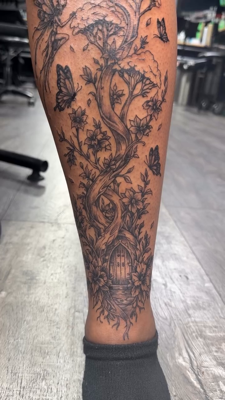 Tree and butterfly illustrative tattoo by Shaunboweink