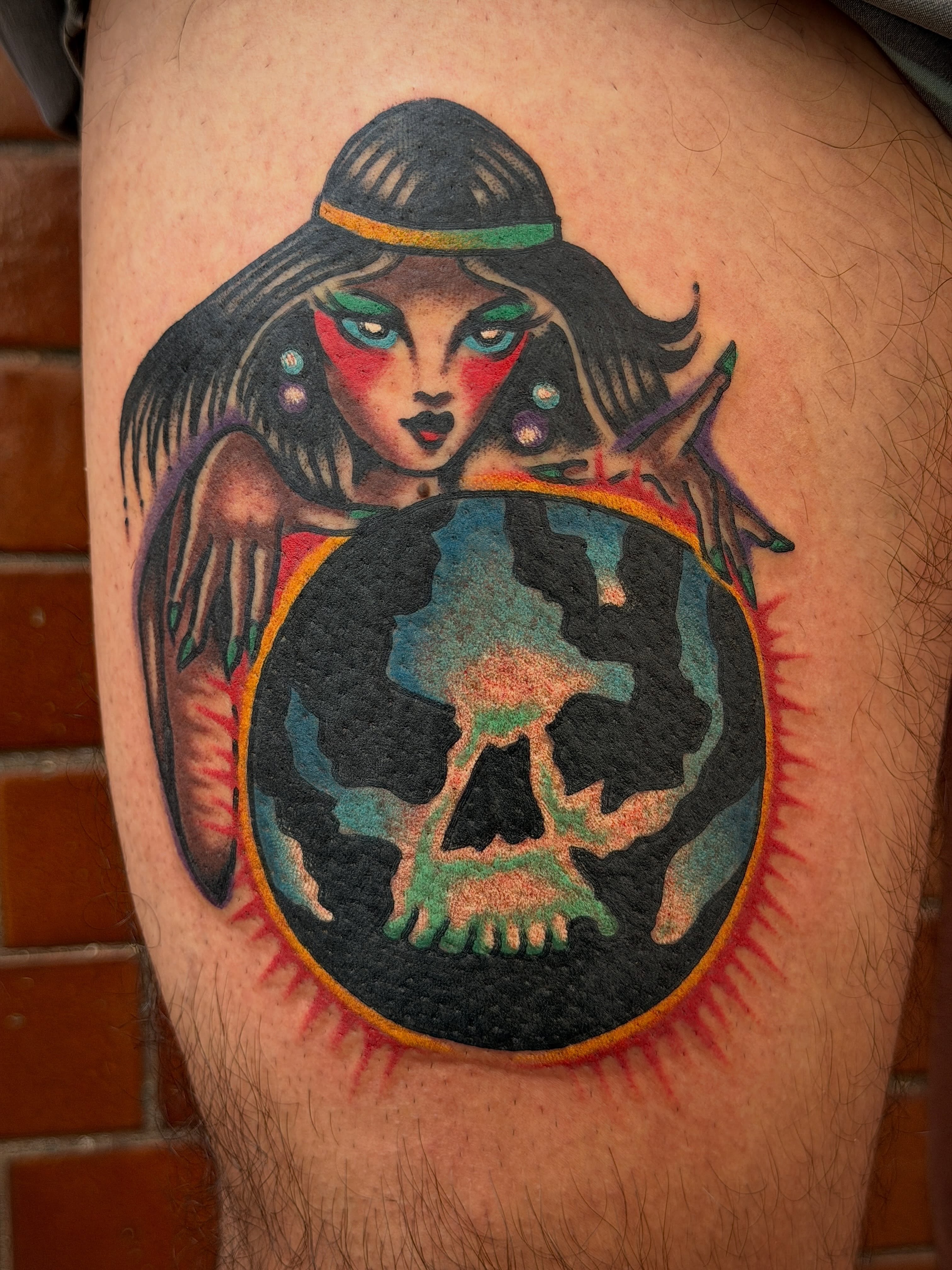 Woman with skull American traditional tattoo on the thigh by Joshua Speight