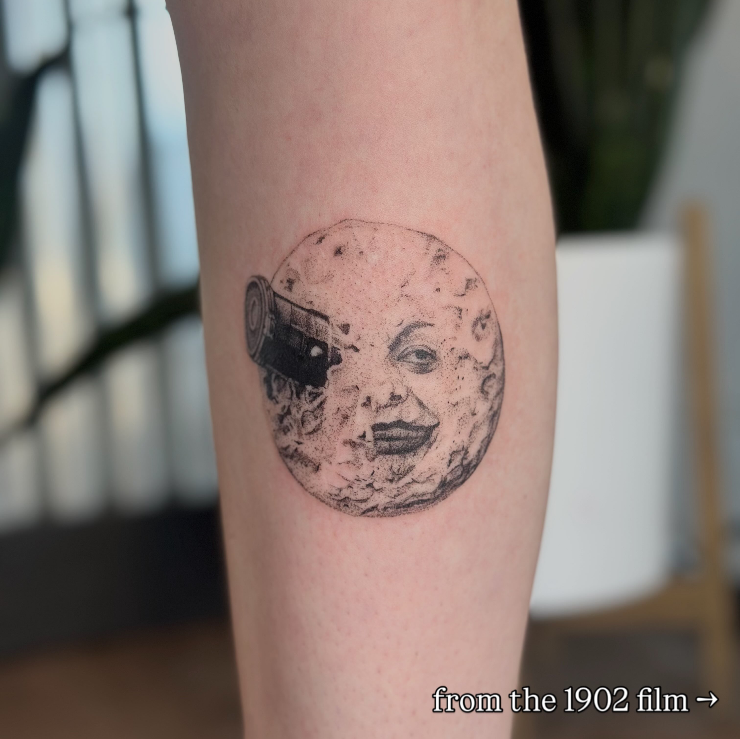Moon with face and camera dotwork tattoo on the forearm by sara scak, Lakewood, Ohio