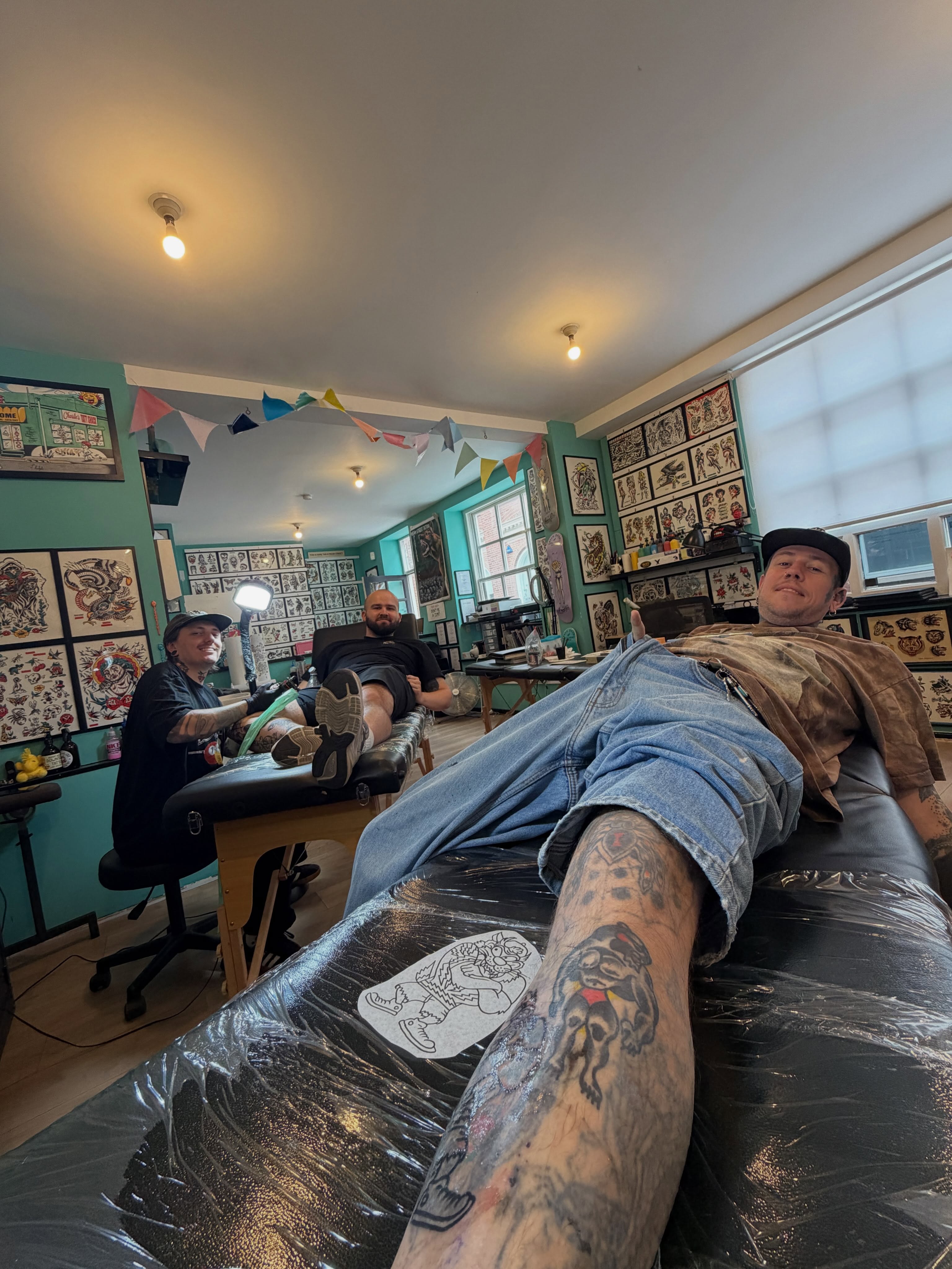 Dog American traditional tattoo on the leg by Joshua Speight