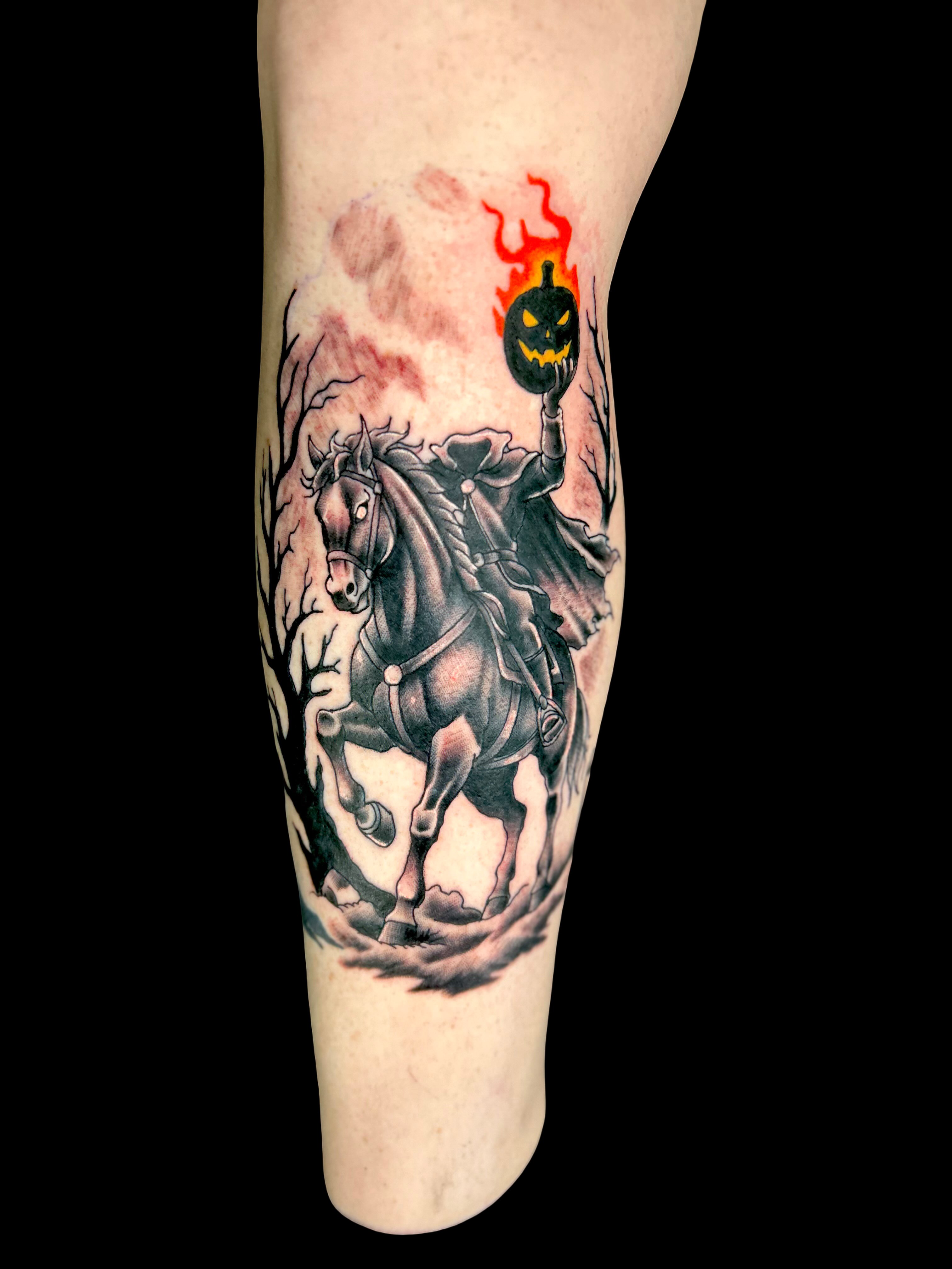 Horseman with jack-o'-lantern dark realism tattoo on the calf by Austin Young