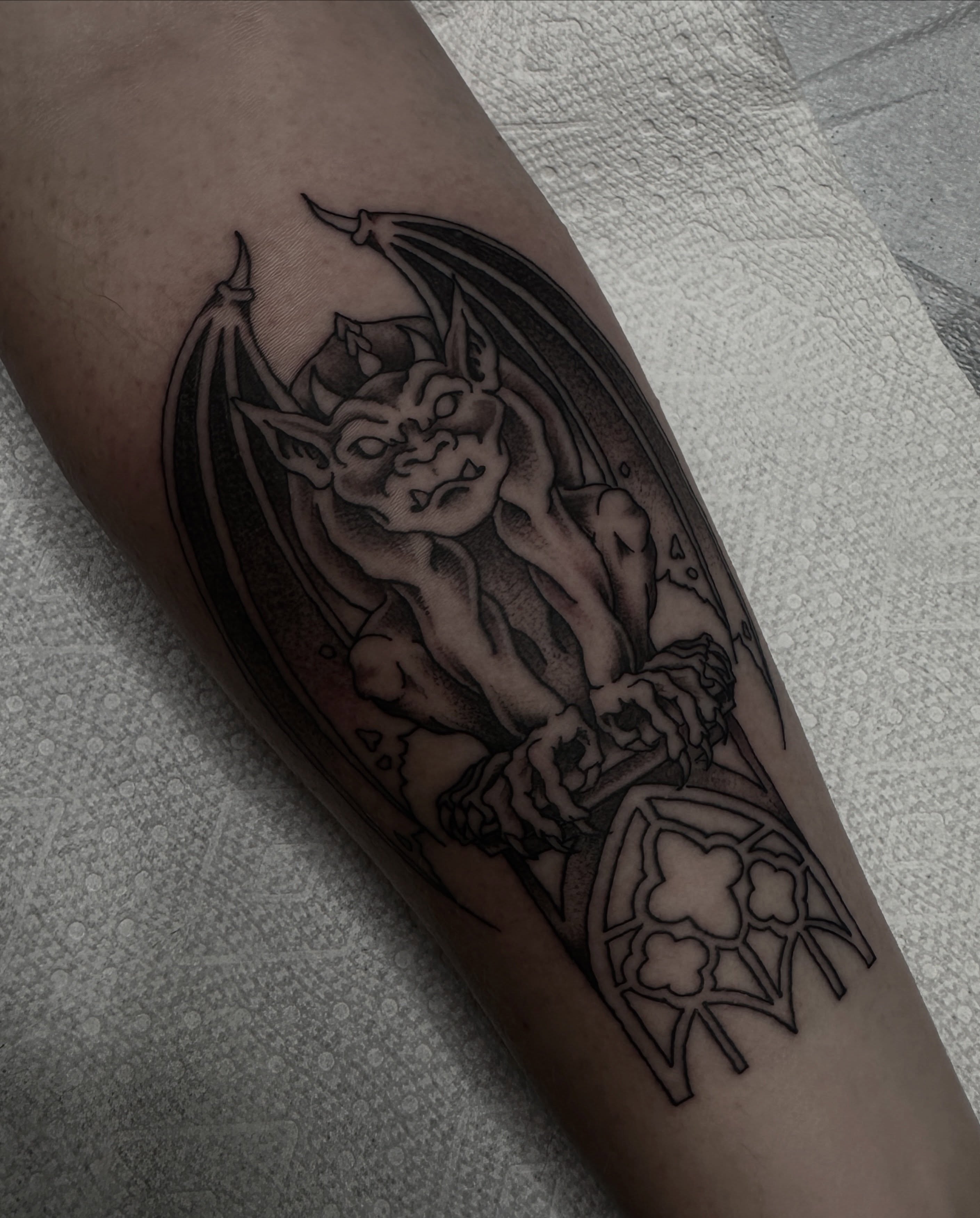 Gargoyle black and grey tattoo on the forearm by ππ¦π βπ¬π²π«π±π°