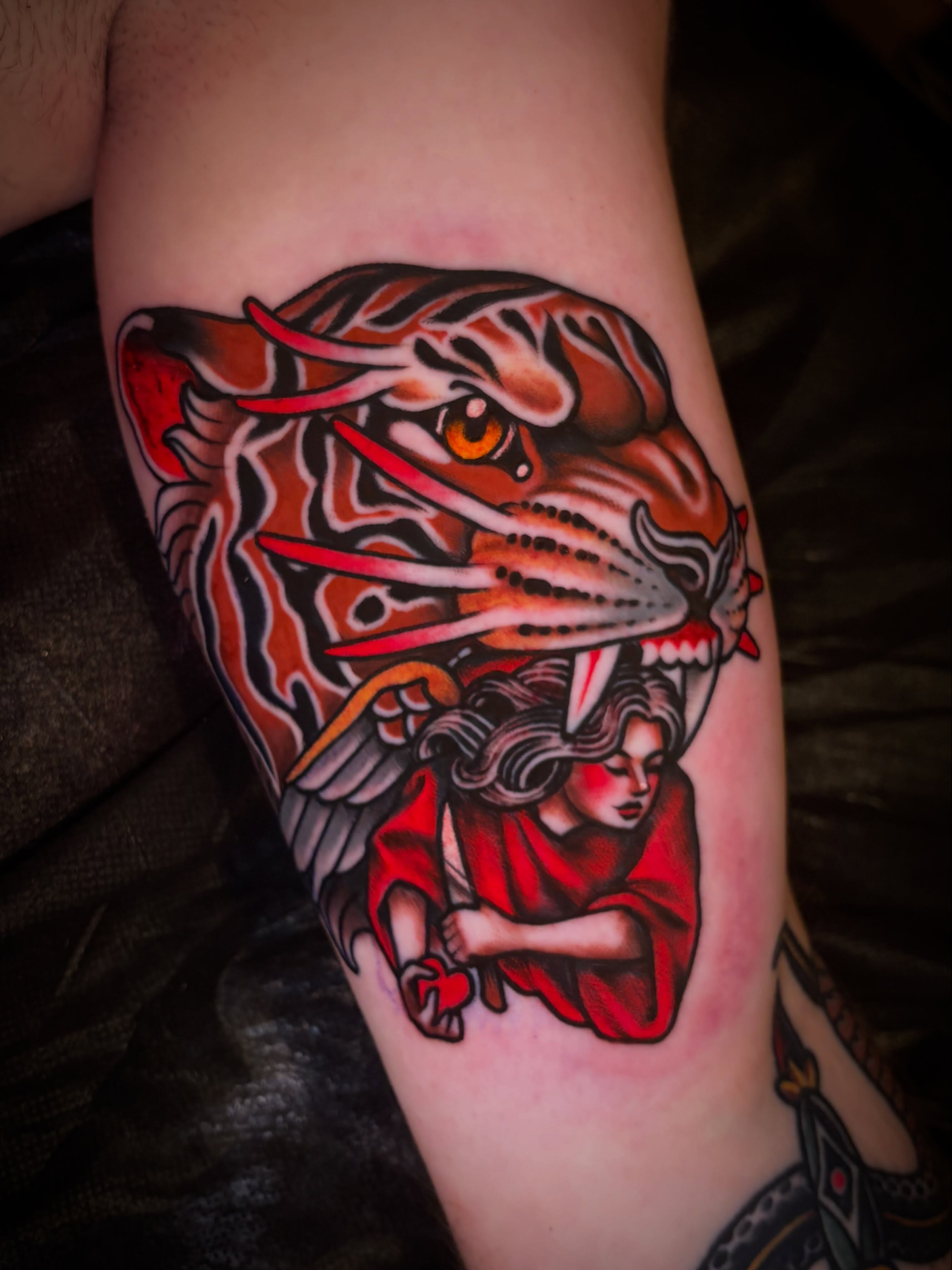 Woman and tiger American traditional tattoo on the forearm by ๐ป๐๐๐ ๐ณ๐๐๐๐๐๐ ๐๐๐