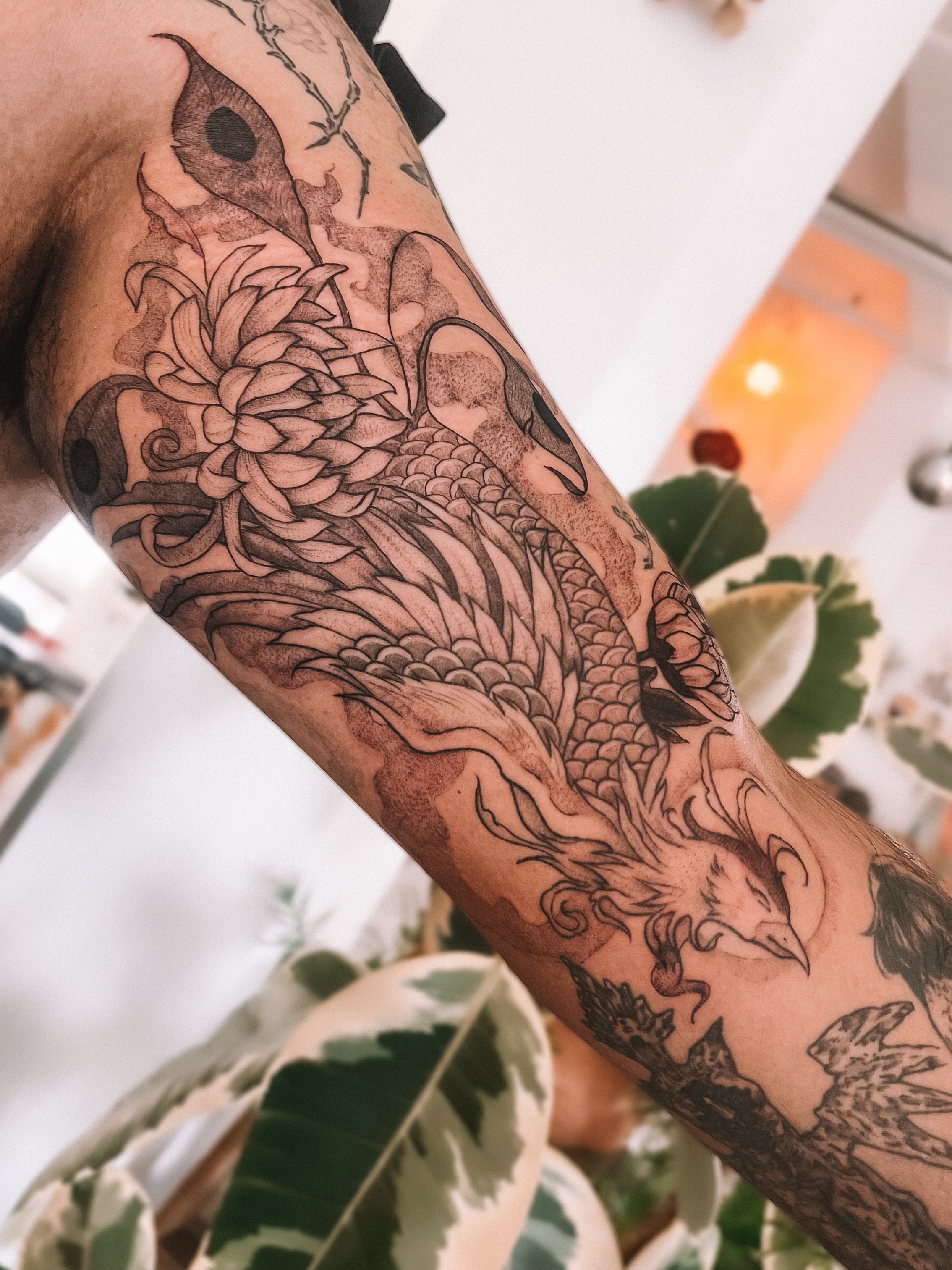 Koi fish and chrysanthemum dotwork tattoo on the forearm by sebs phạm, Los Angeles, California