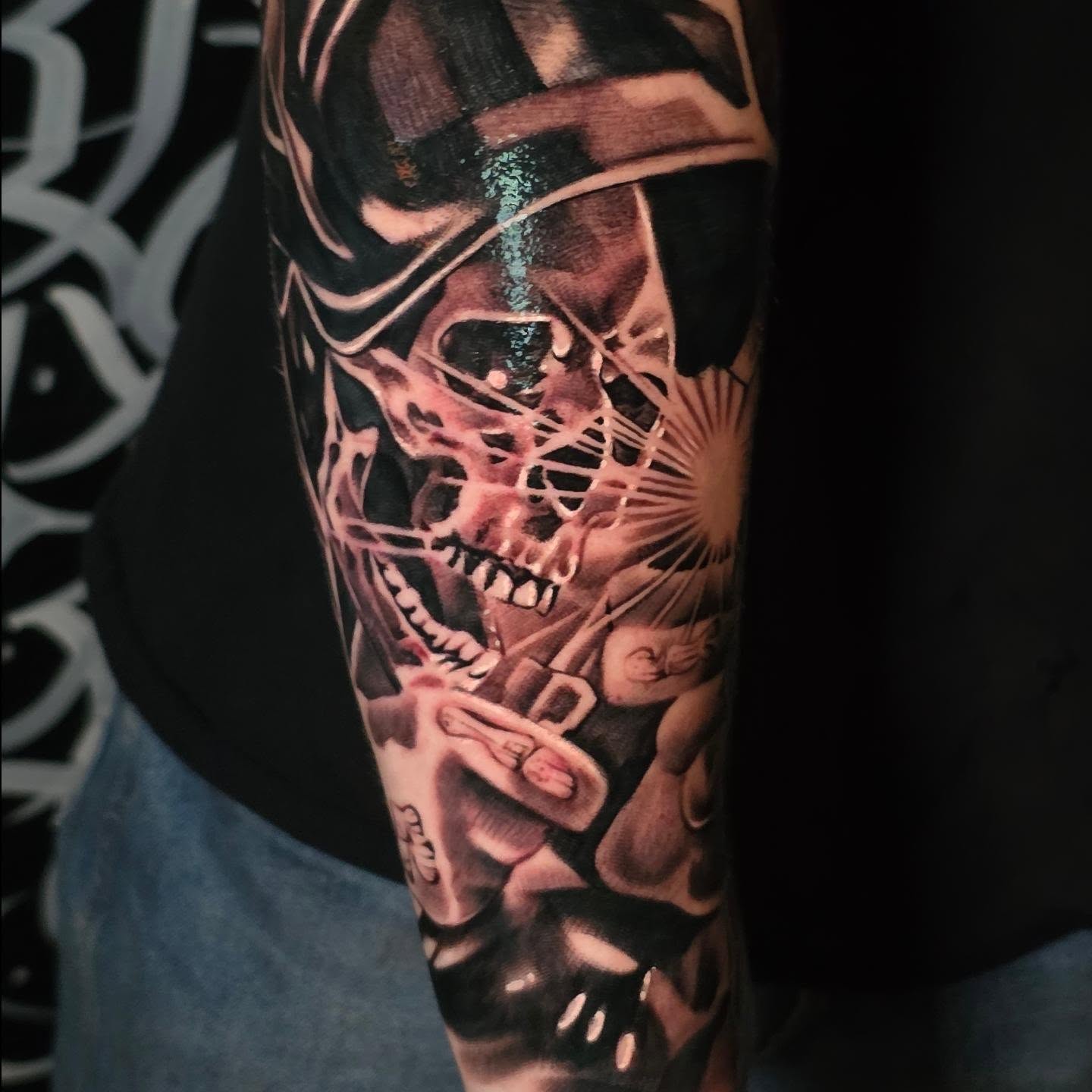 Skull and fan dark realism tattoo on the forearm by Tattoo Seez, Wichita, Kansas