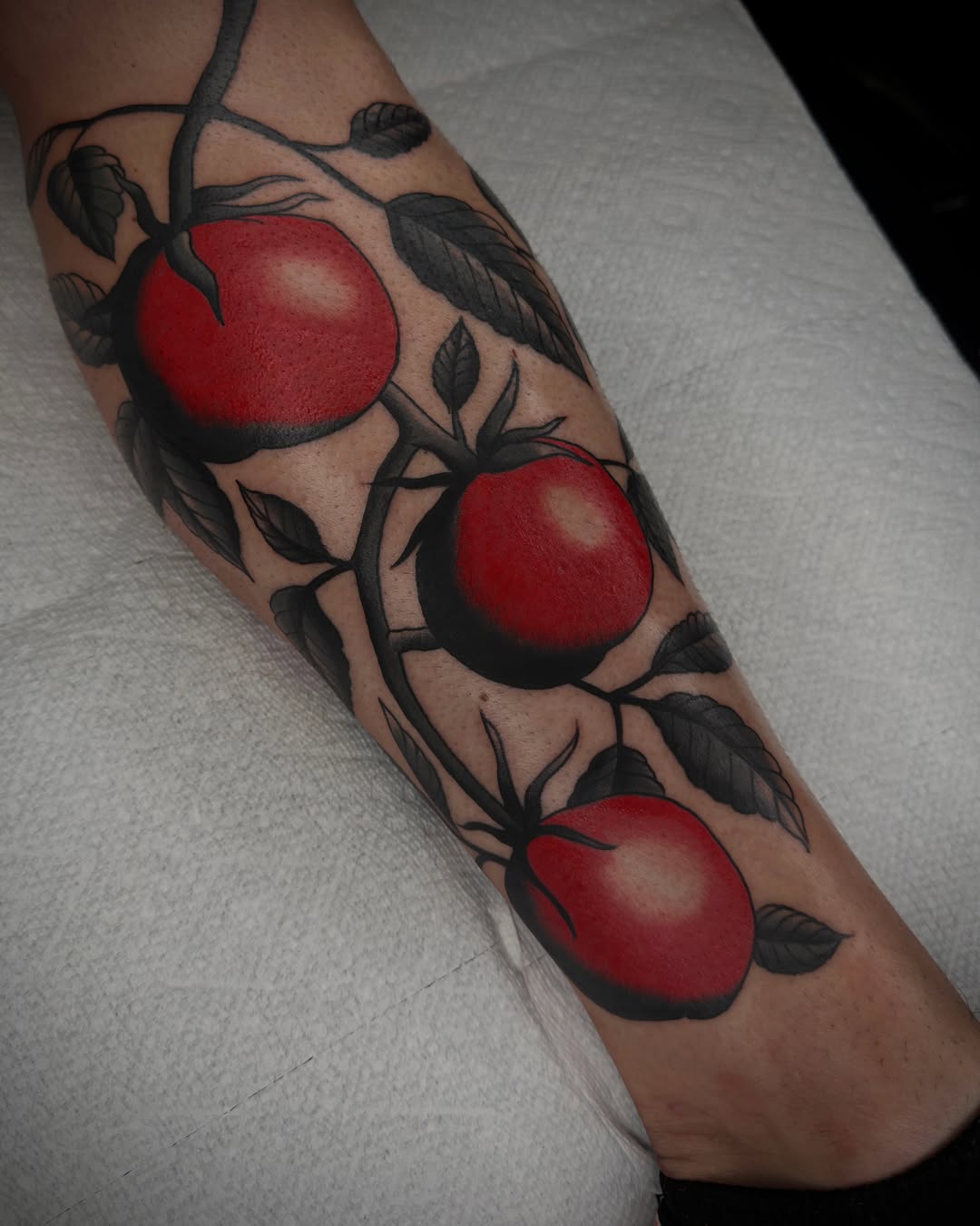 Tomatoes American traditional tattoo on the forearm by Diego Treviño