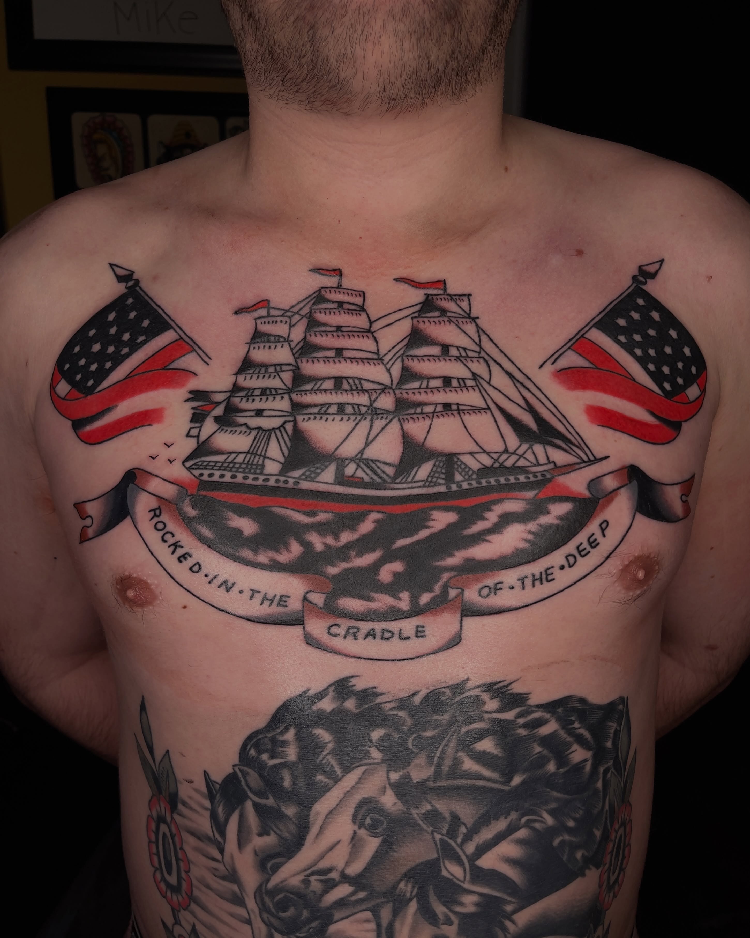 Ship and flags American traditional tattoo on the chest by Diego Treviño