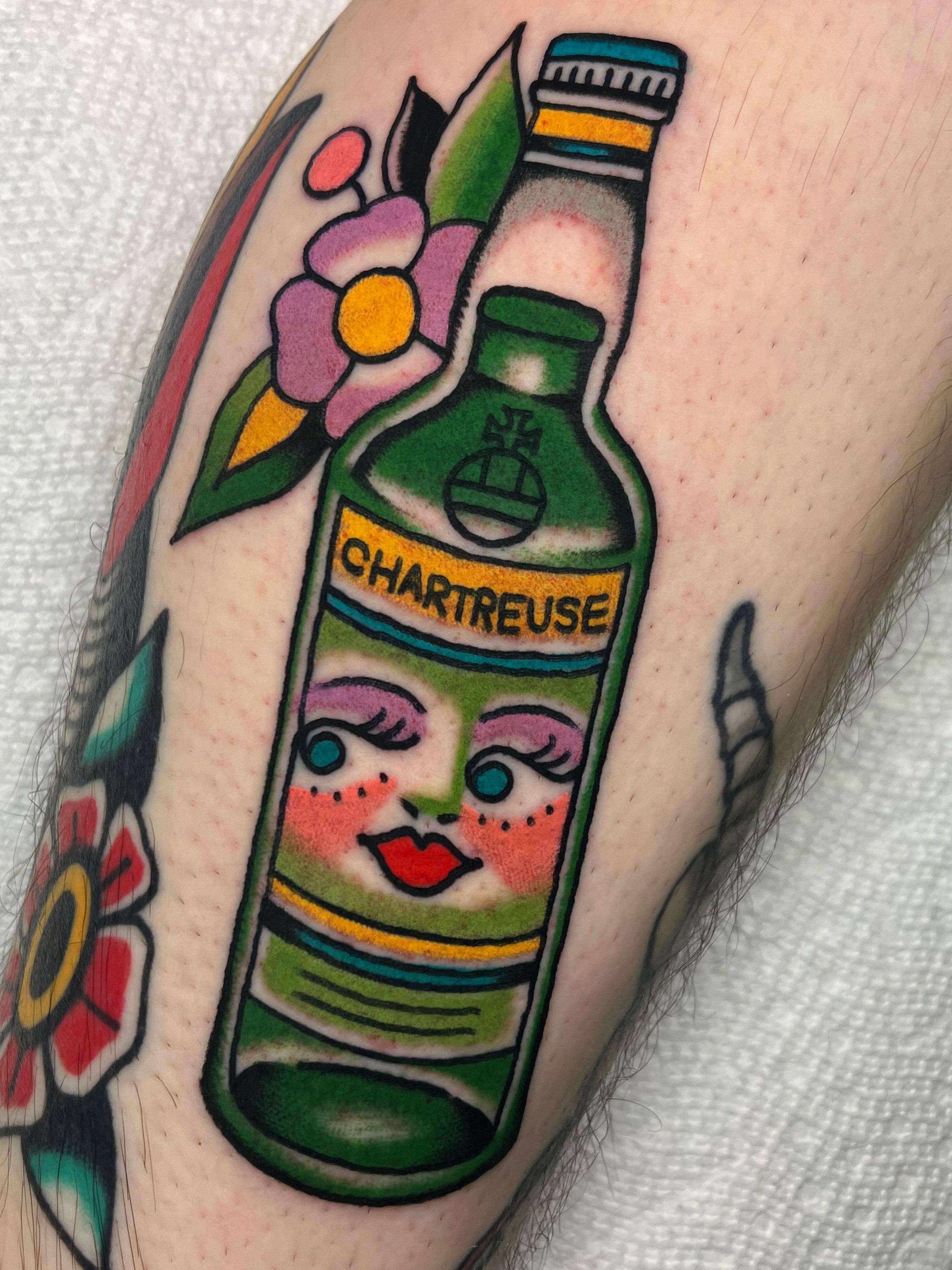 Chartreuse bottle American traditional tattoo on the forearm by ⭐️ Erin Bauer ⭐️