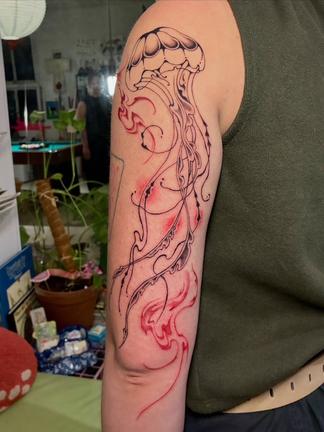 Jellyfish and abstract red elements Japanese tattoo on the forearm by thalia