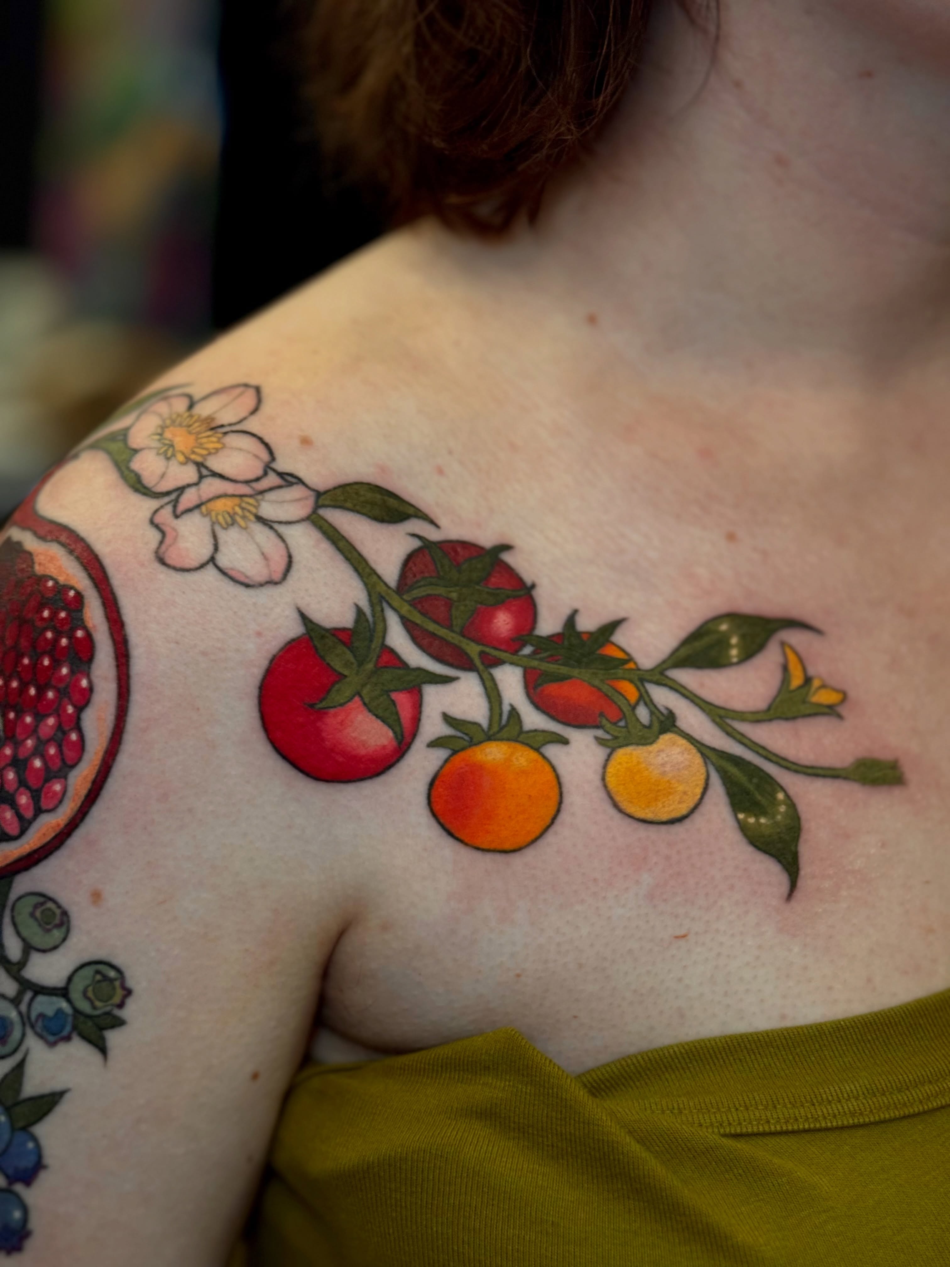 Tomatoes and flowers realism tattoo on the shoulder by Hailey K - Arizona Tattoo Artist, Miami, Florida