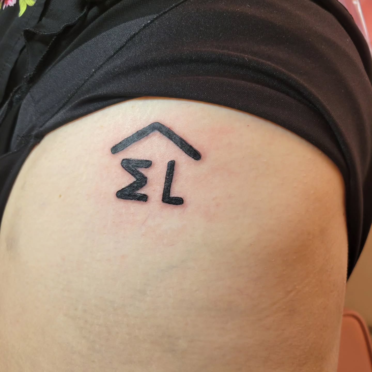 House symbol geometric tattoo on the thigh by Peach & Poke, Lethbridge, Alberta