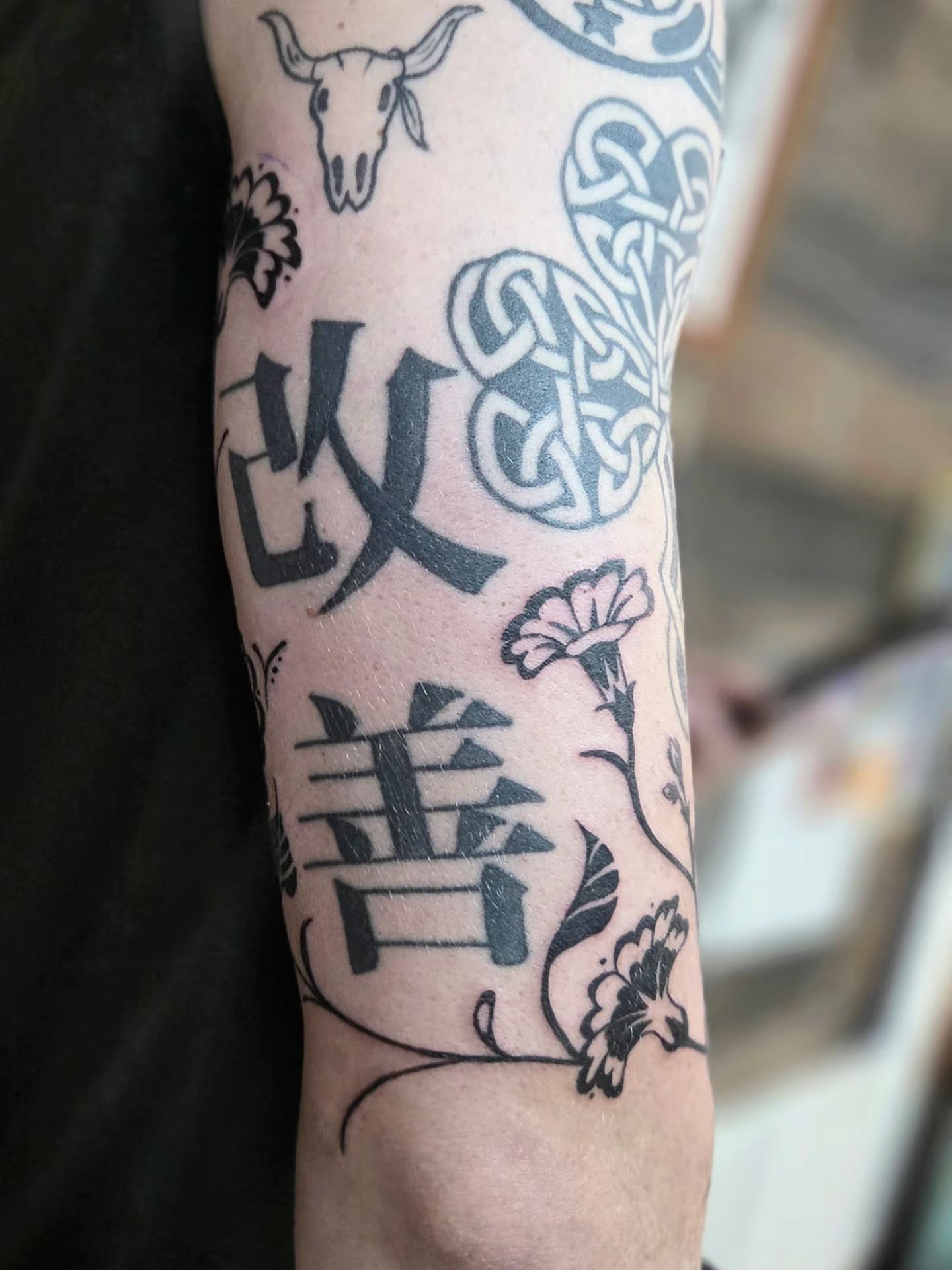 Kanji characters black and grey tattoo on the forearm by Courtney, Lakewood, Ohio