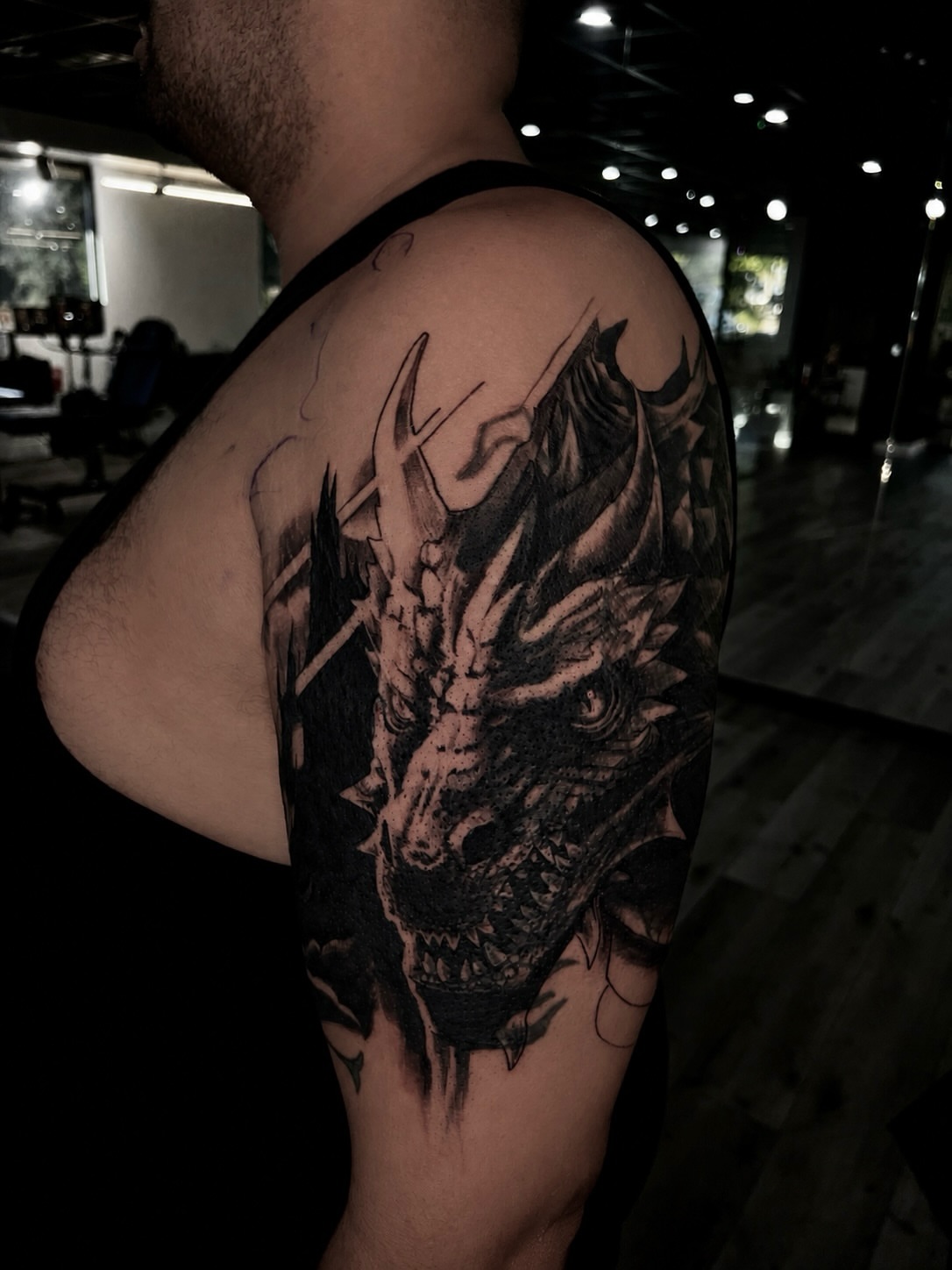Dragon realism tattoo on the shoulder by Tattoo Artist Mimzi PMA
