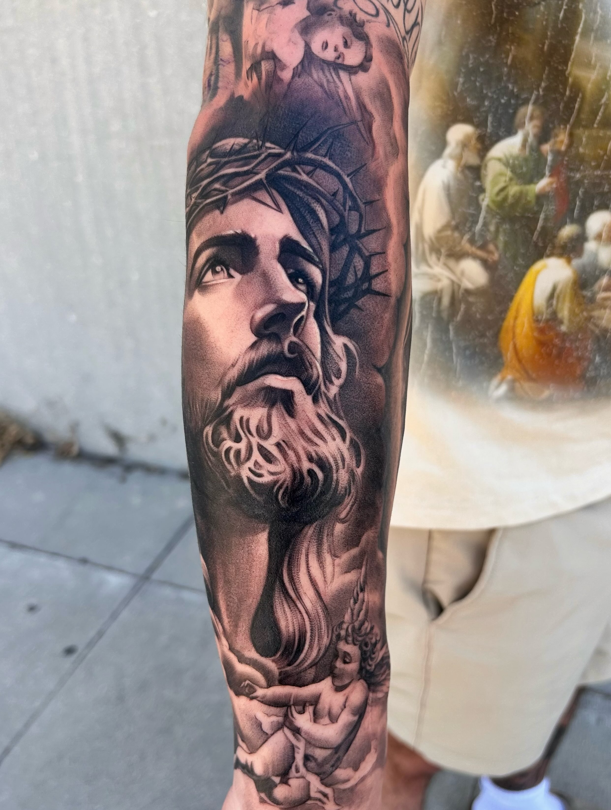 Religious figure realism tattoo on the forearm by Tattoos by Anthony Davis