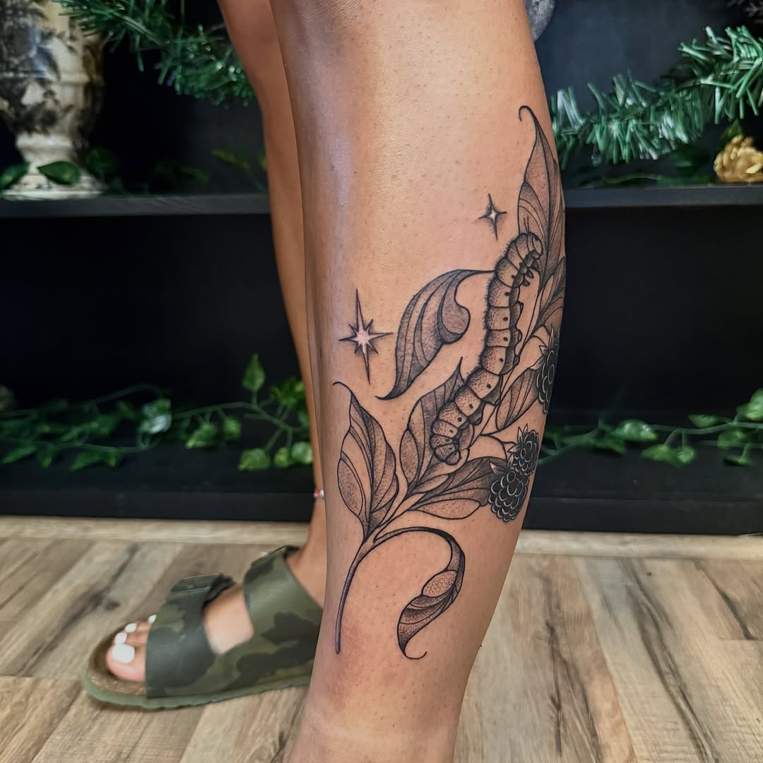 Caterpillar and leaves dotwork tattoo on the calf by Haley Bates