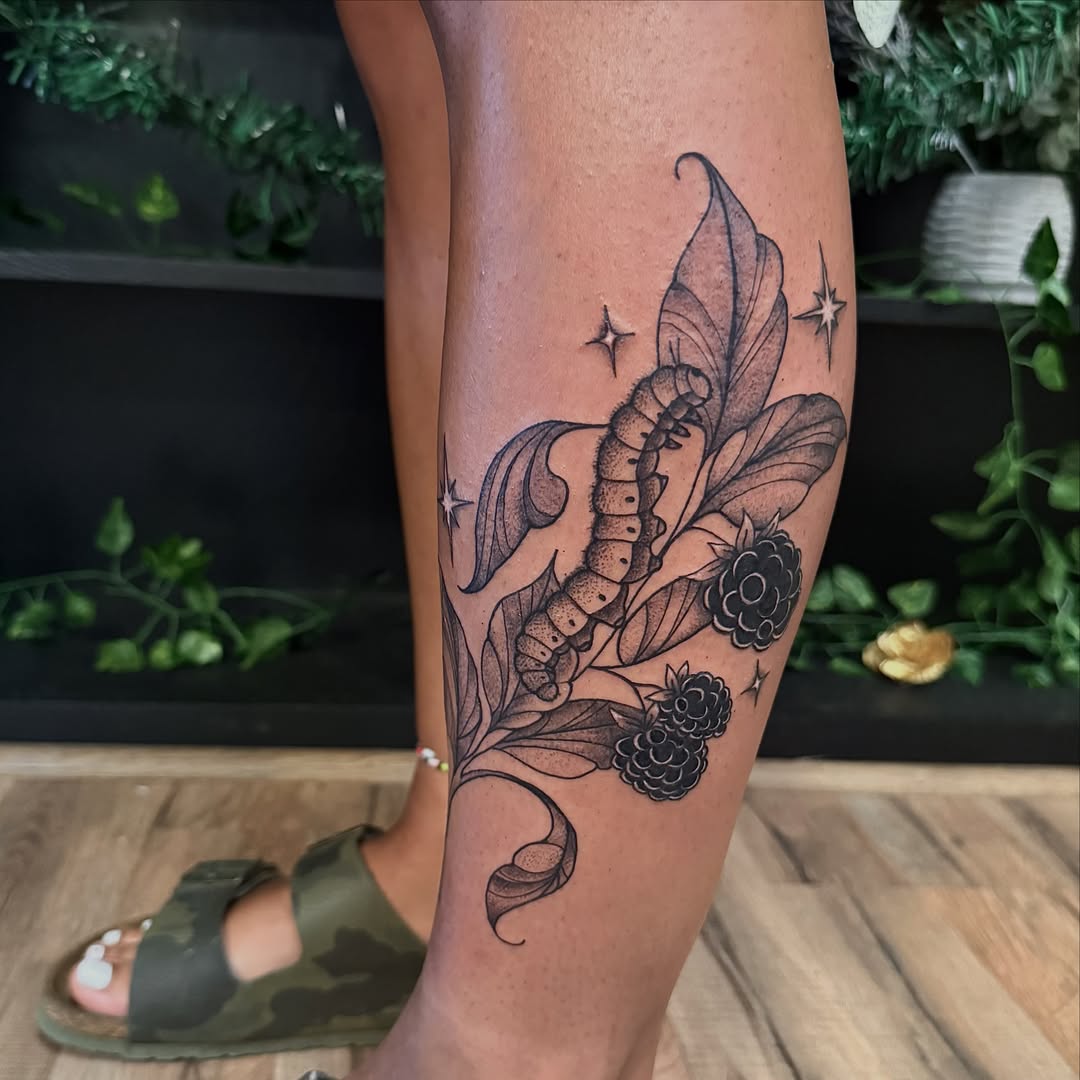 Berry plant black and grey tattoo on the forearm by Haley Bates