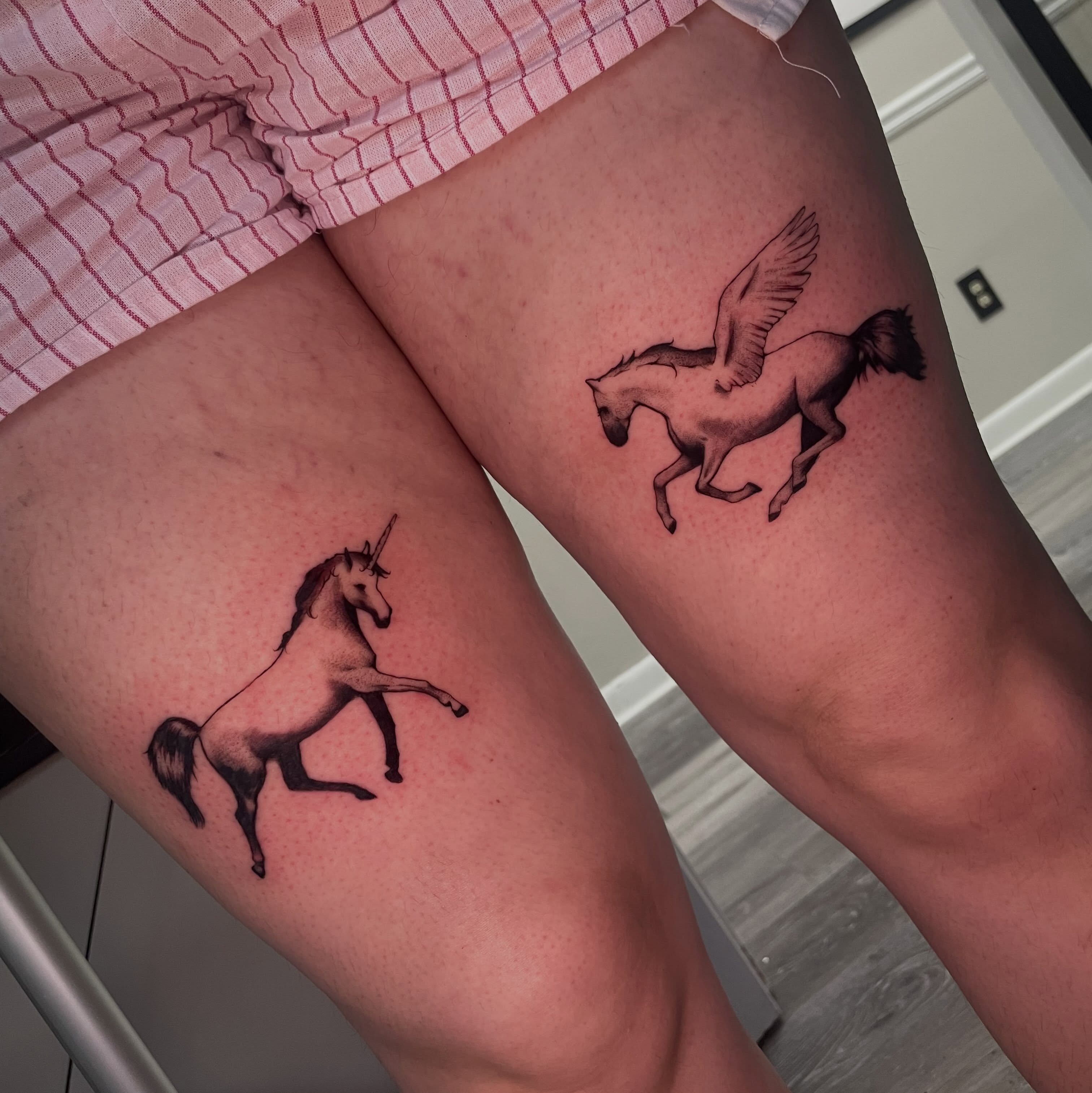 Unicorns black and grey tattoo on the thigh by sanjai