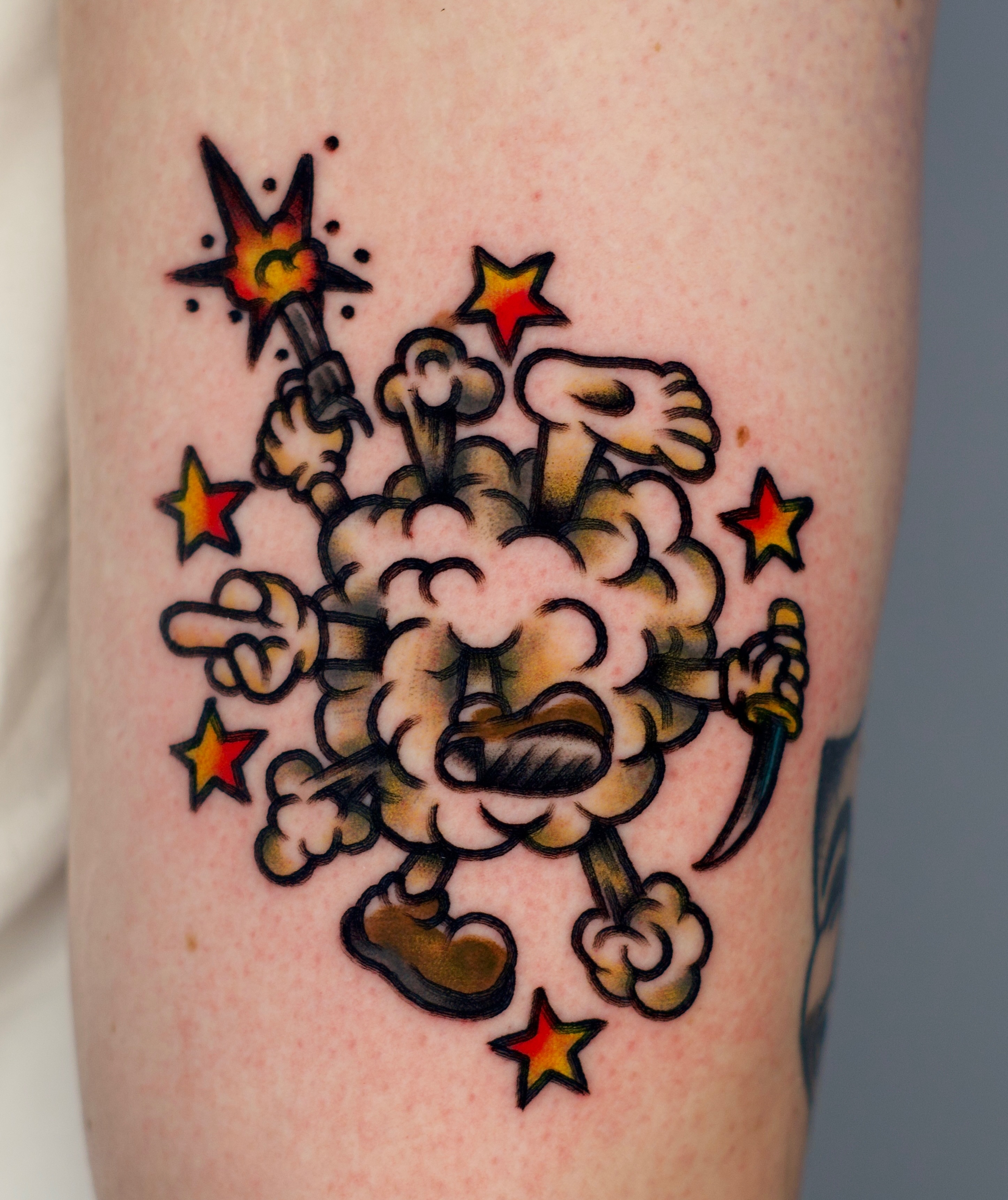 Smoke cloud with stars American traditional tattoo on the forearm by Tattooer Sancho 🇰🇷🇨🇦