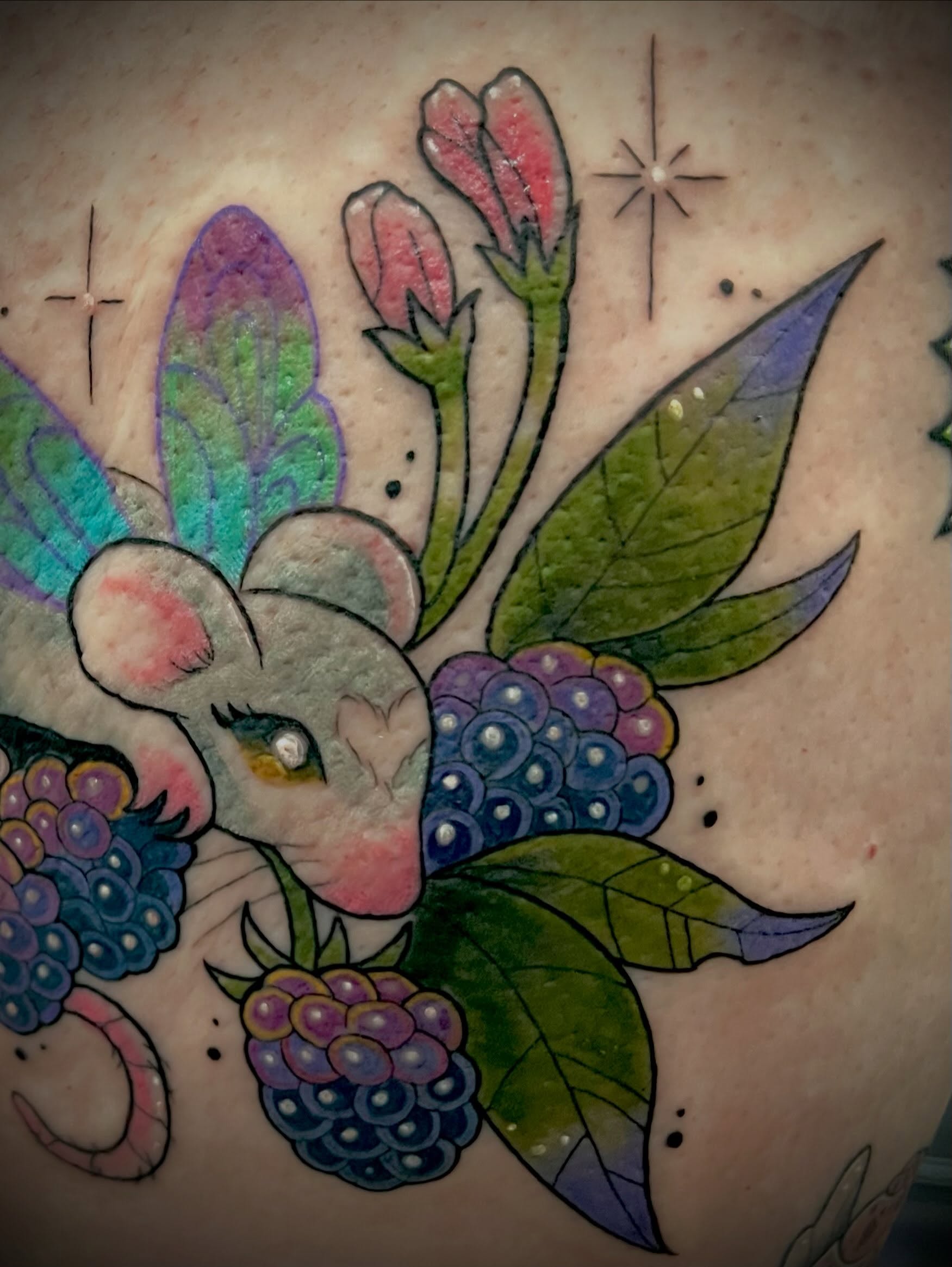 Mouse and berries American traditional tattoo on the chest by Freya Petersen