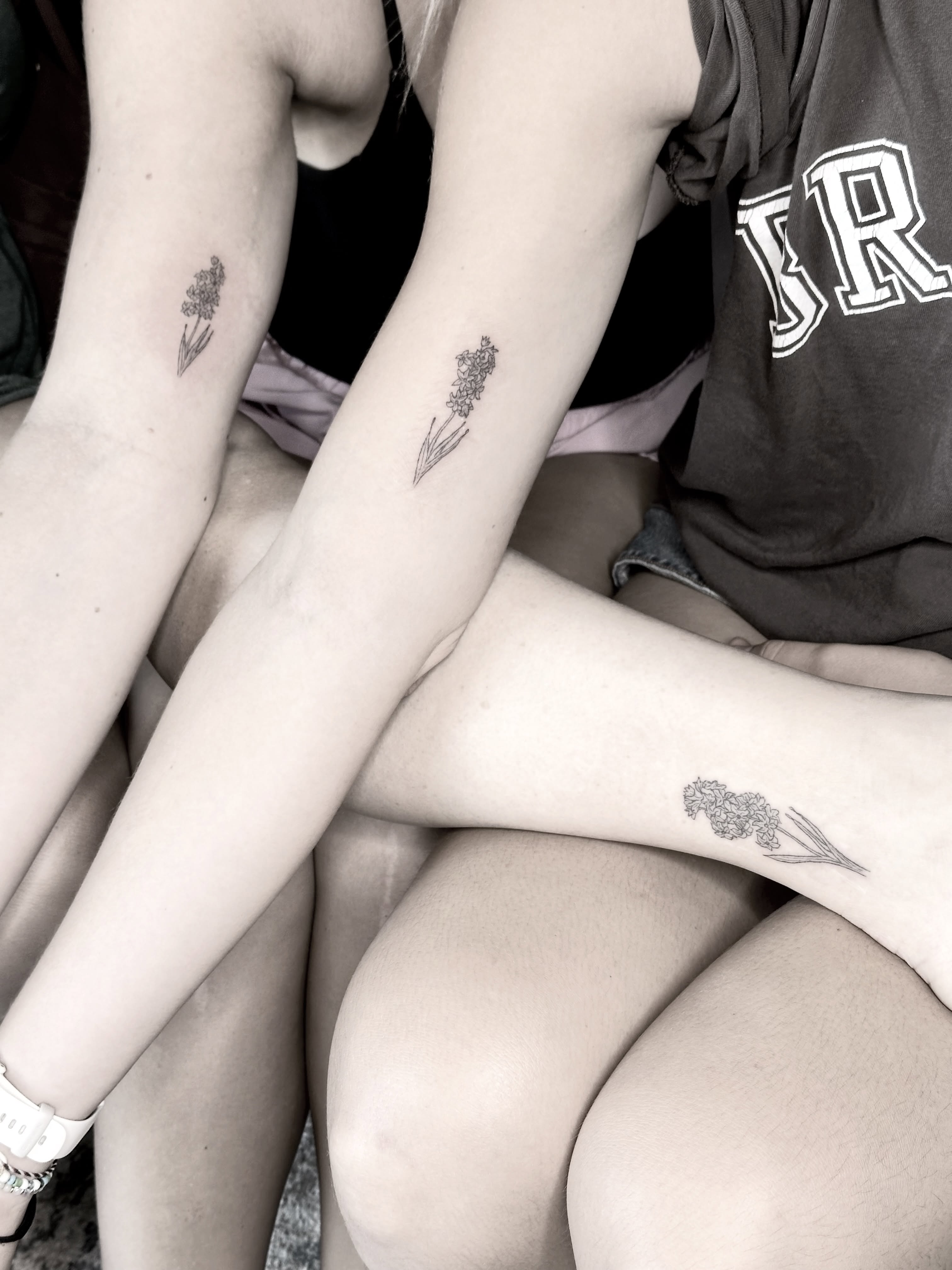Flower black and grey tattoo on the forearm by Liz