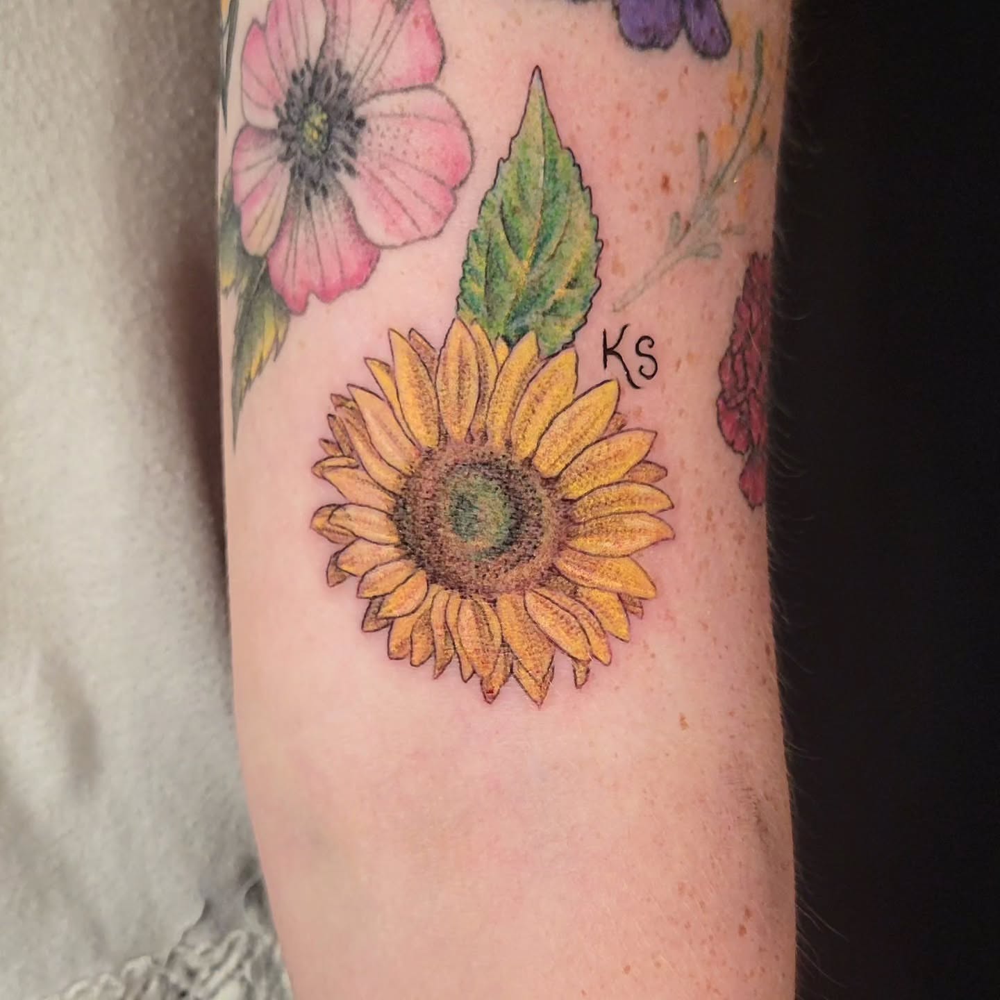 Sunflower realism tattoo on the forearm by Sarah Alba