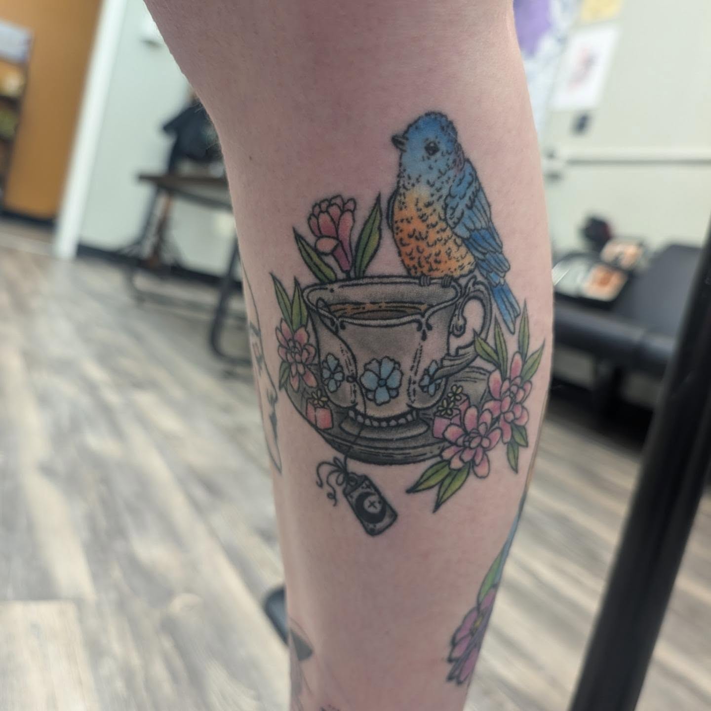 Bird and teacup American traditional tattoo on the forearm by Talia Zula, Loveland, Ohio