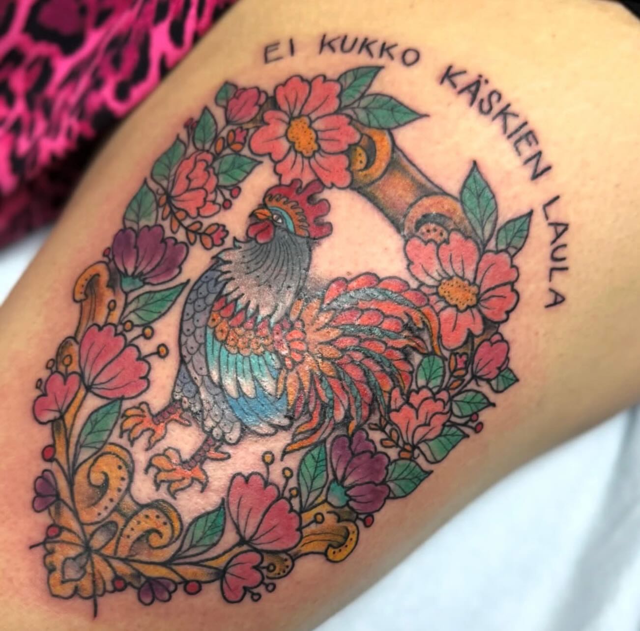 Rooster and floral wreath new school tattoo on the forearm by Tattoos By Trish