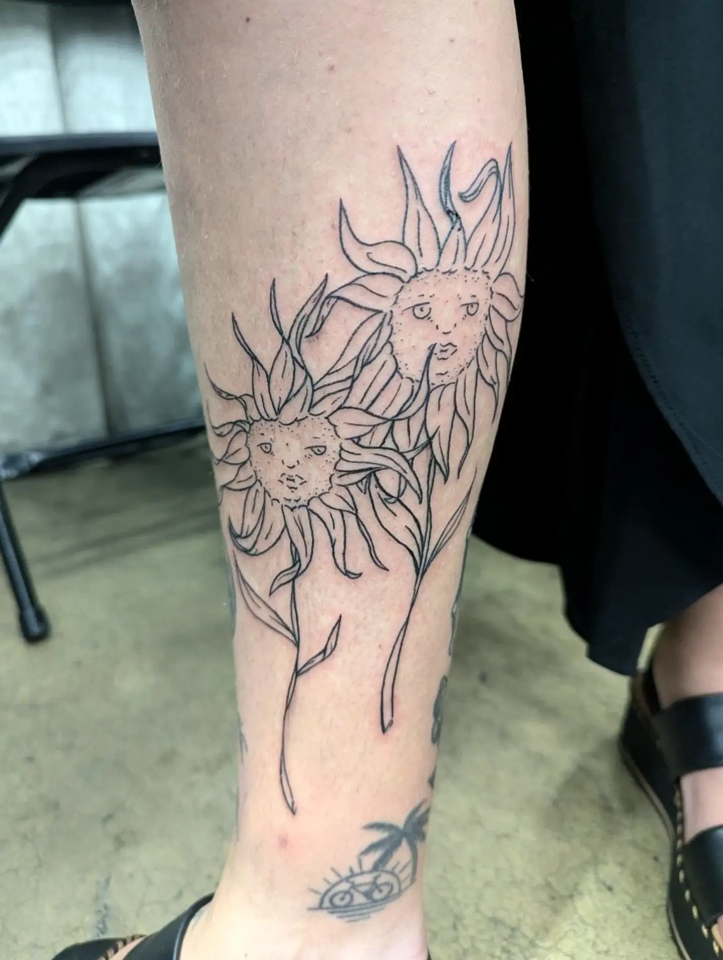 Sunflowers black and grey tattoo on the forearm by Patricio