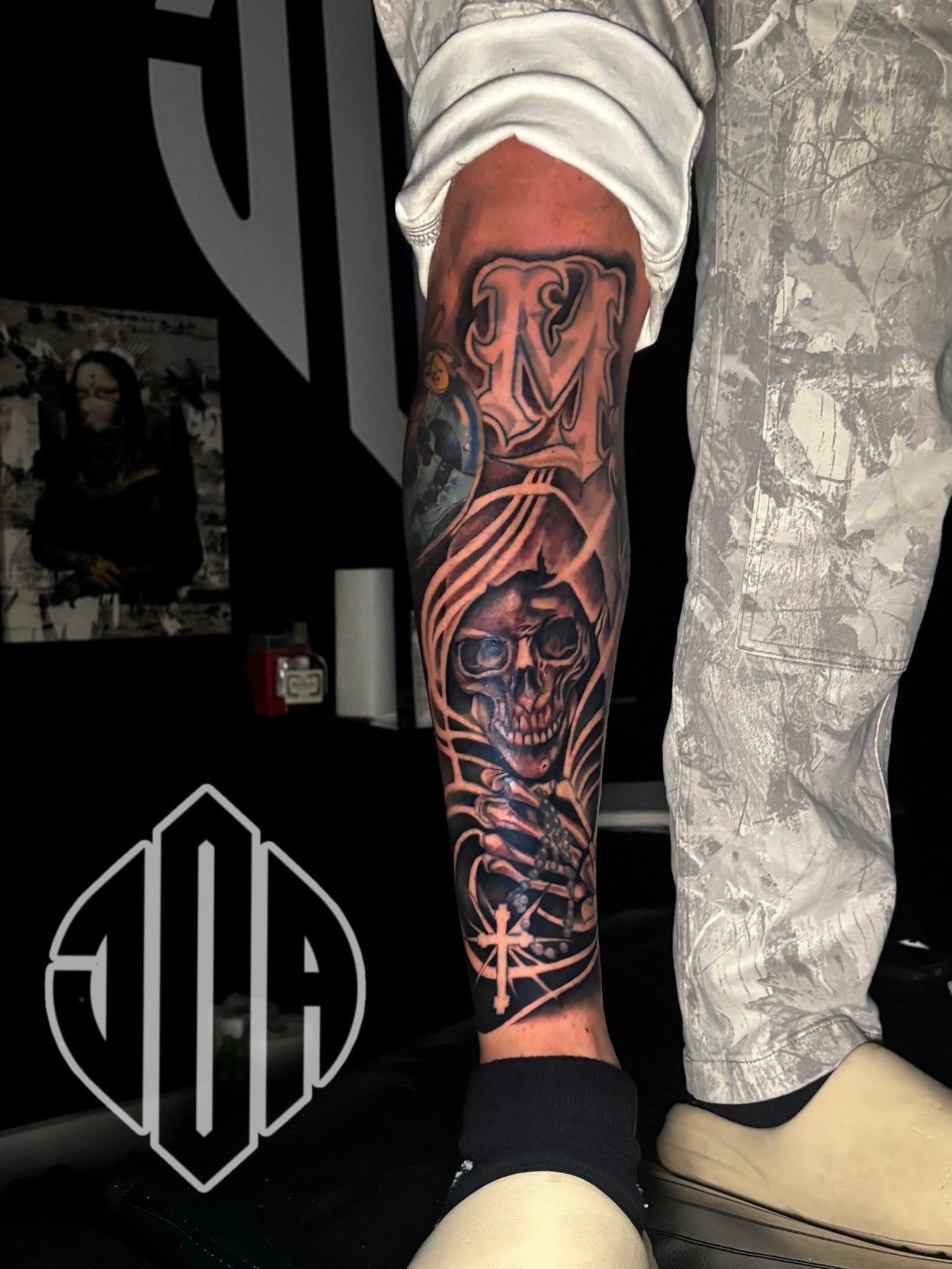 Reaper skull dark realism tattoo on the forearm by Jay Daartist