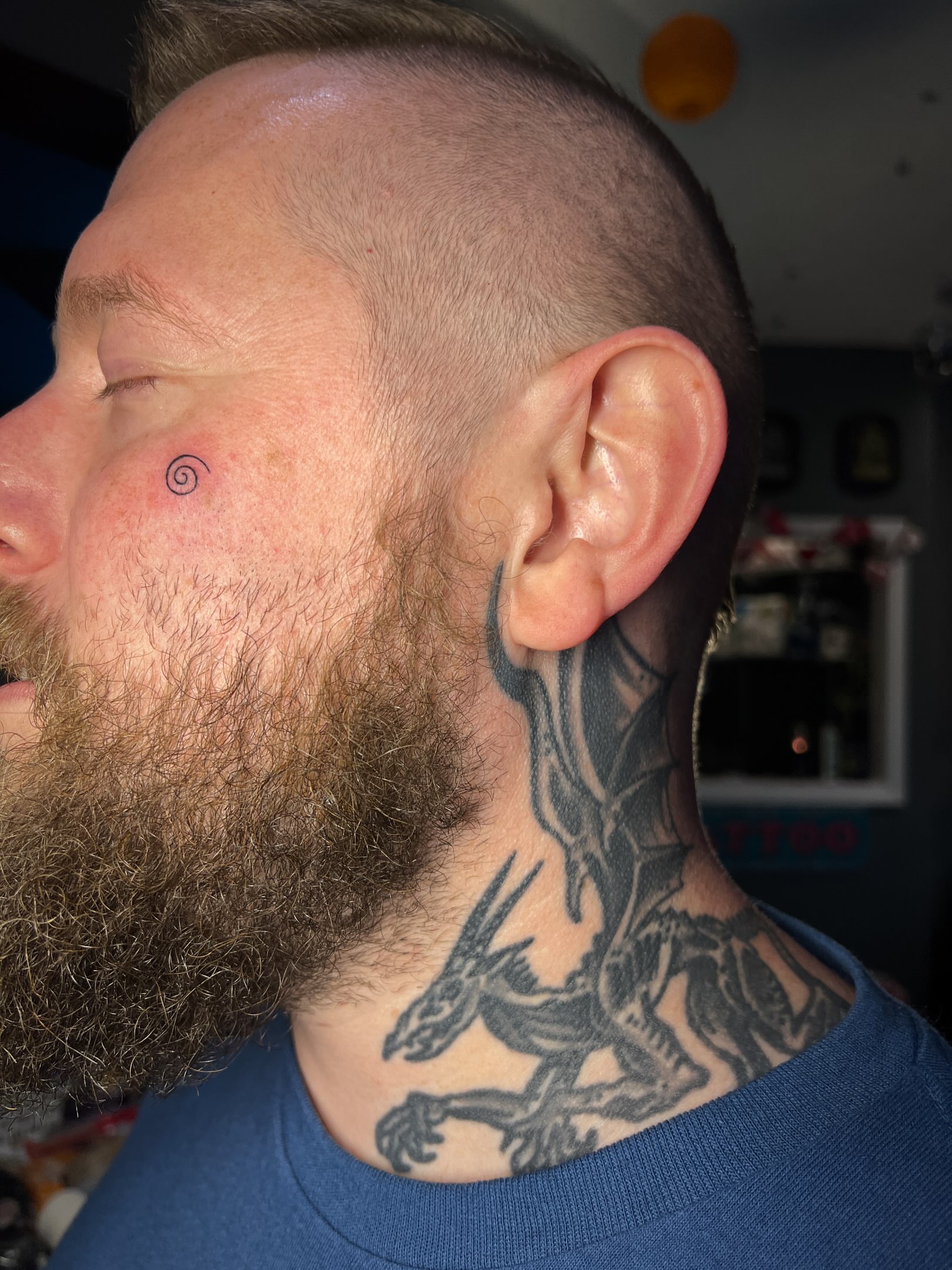 Dragon black and grey tattoo on the neck by Tattoo Kayla