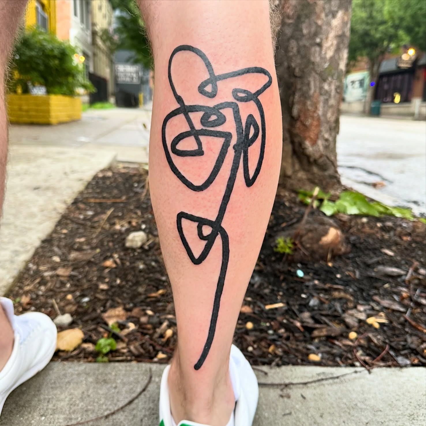 Abstract symbol minimalist tattoo on the forearm by reid - tattoo artist