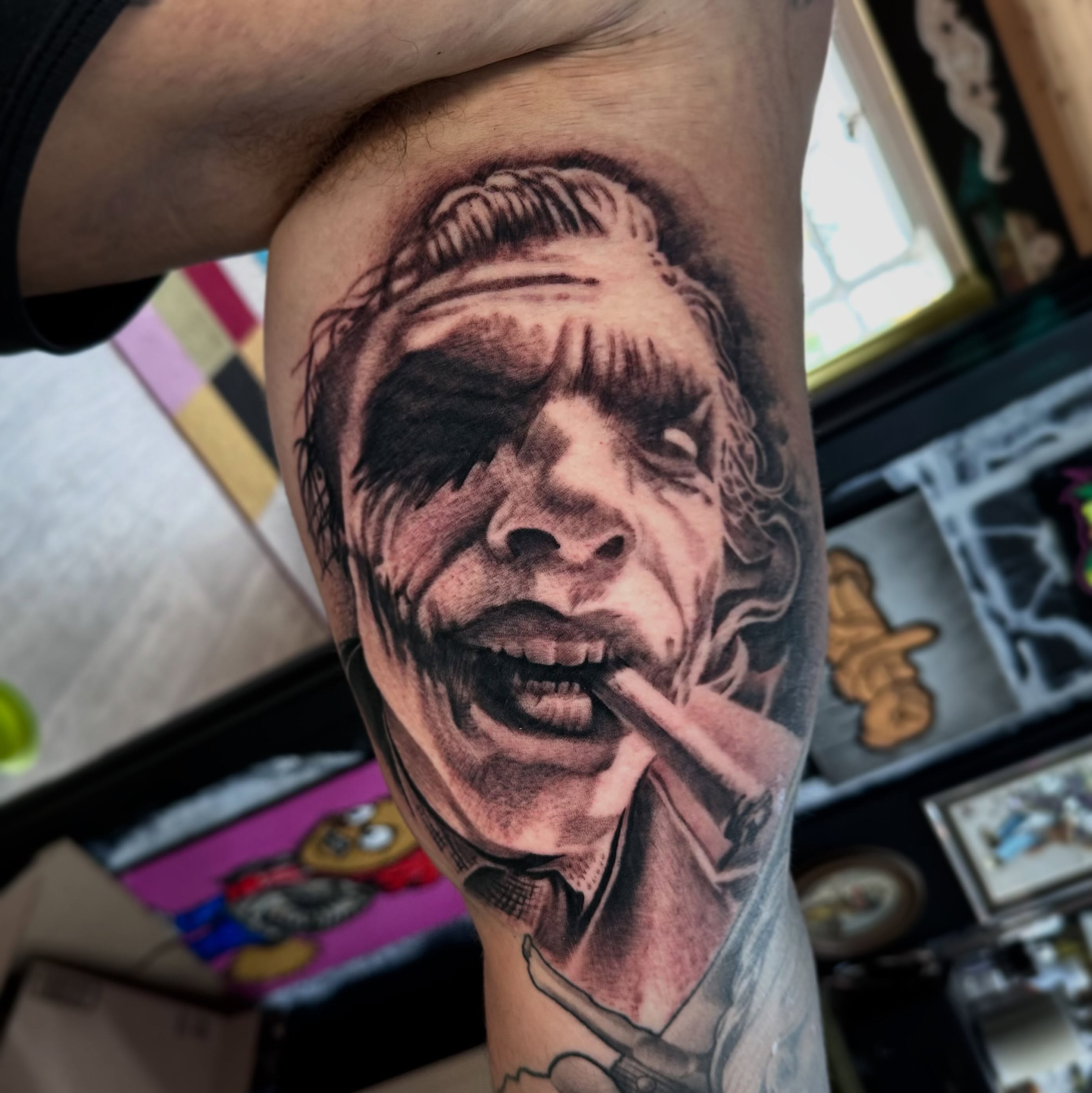 Joker smoking realism tattoo on the forearm by Dustin Clark, Dayton, Ohio