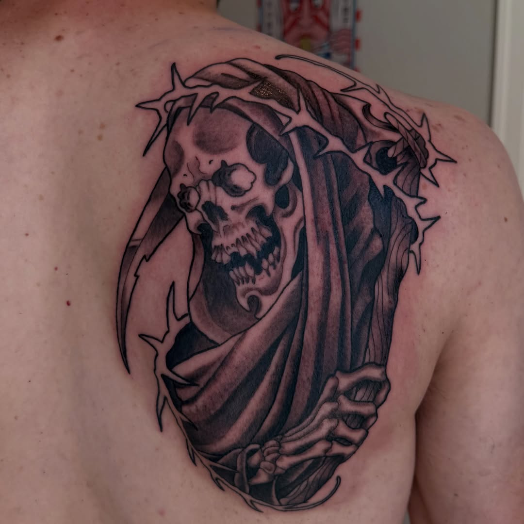 Grim reaper realism tattoo on the shoulder by Vic Merkley